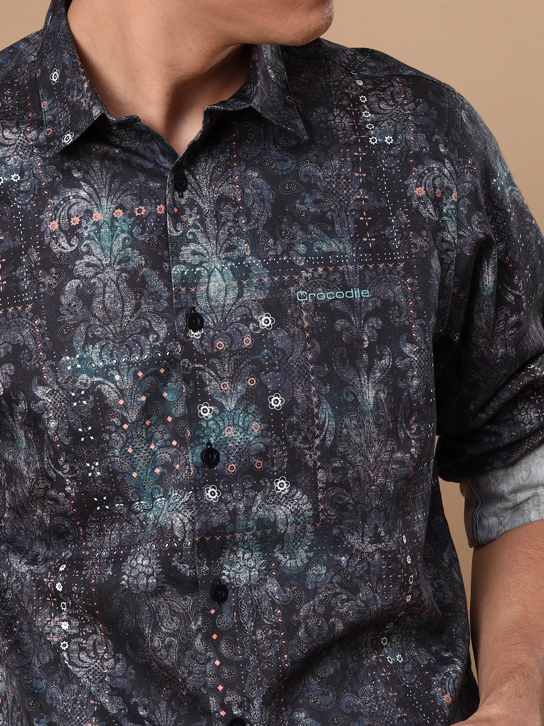 Man wearing a navy printed full sleeve 100% cotton navy casual shirt on a light gray background