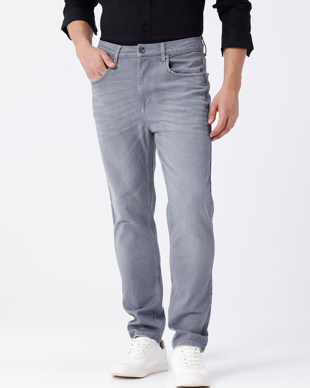 Woman wearing a grey grey twill denim on a light gray background