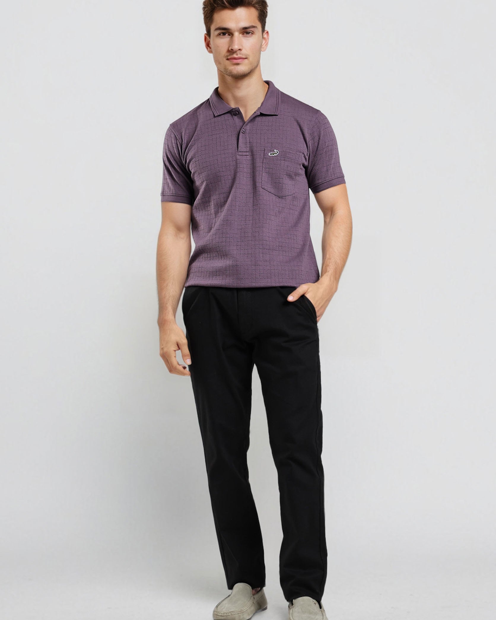 Man wearing a purple striped polo shirt and black pants on a white background