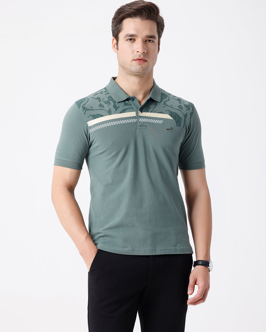 Man wearing a green iceberg green chest print slim fit polo t shirt on a light gray background