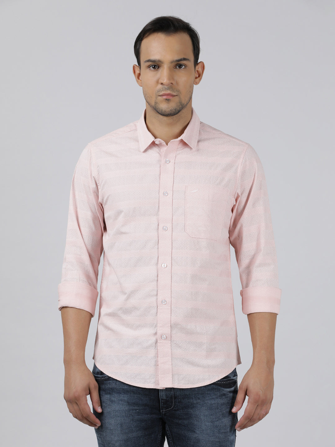 Man wearing a pink pink printed full sleeve 100% cotton shirt on a light gray background