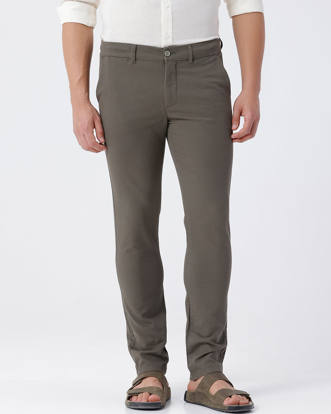 Woman wearing a red soft touch textured chinos olive with casual styling on a gray background
