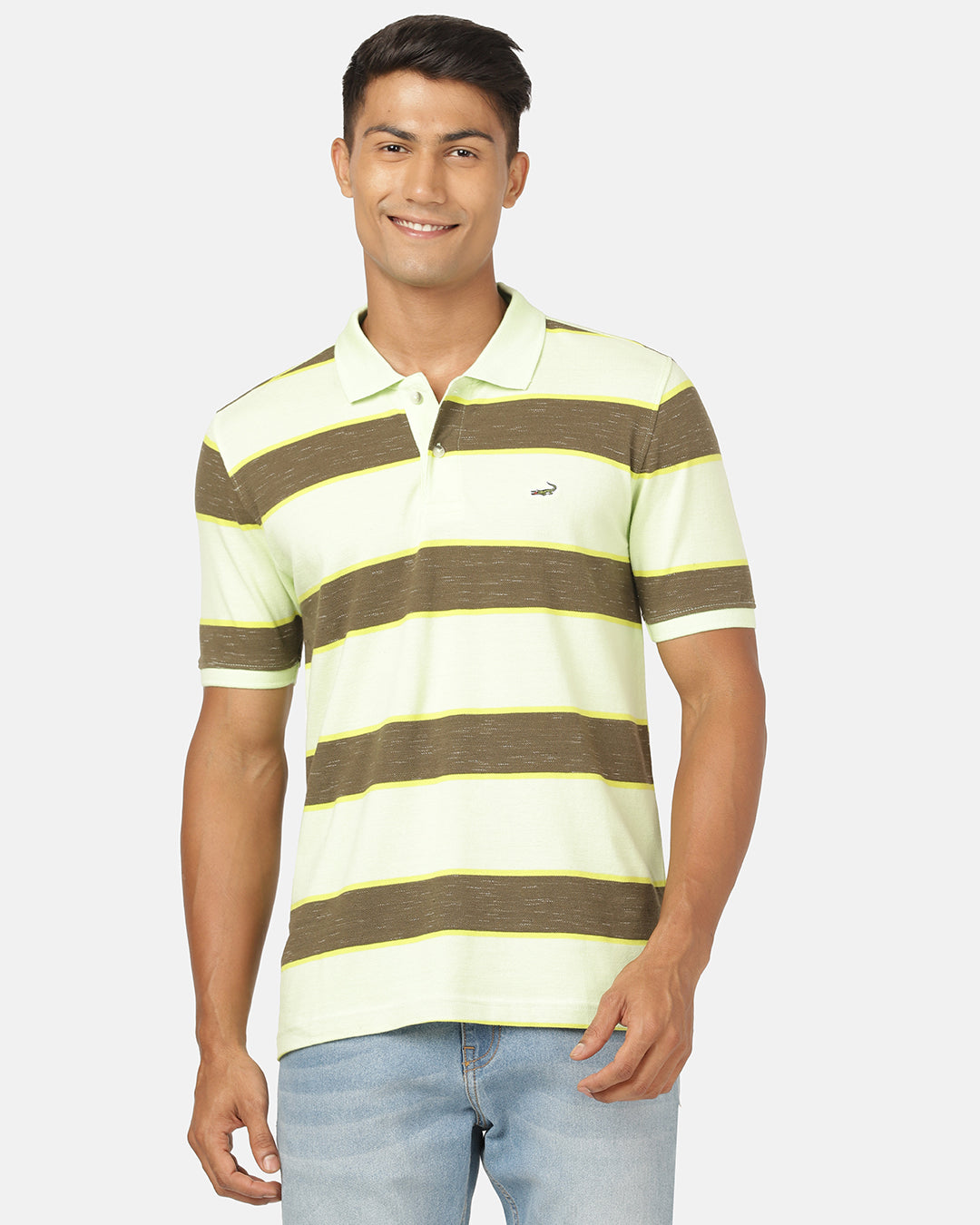 Man wearing a green butterfly green striped polo t shirt with casual styling on a gray background