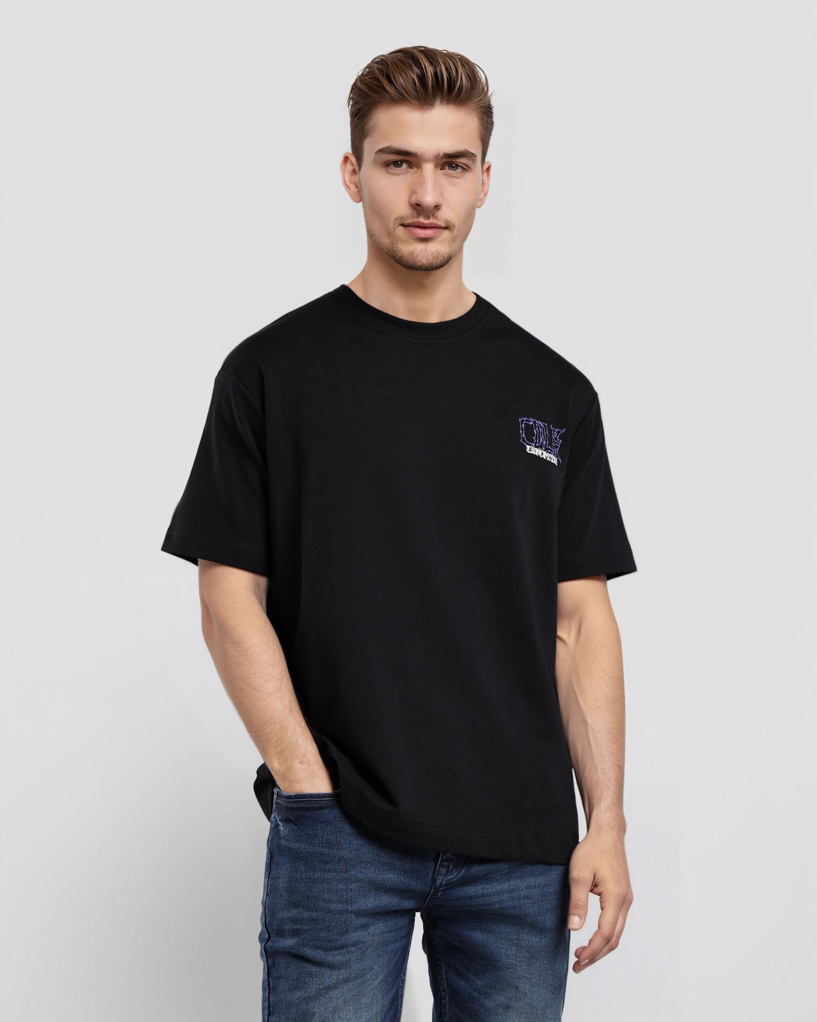 Man wearing a black t-shirt with a logo on a white background