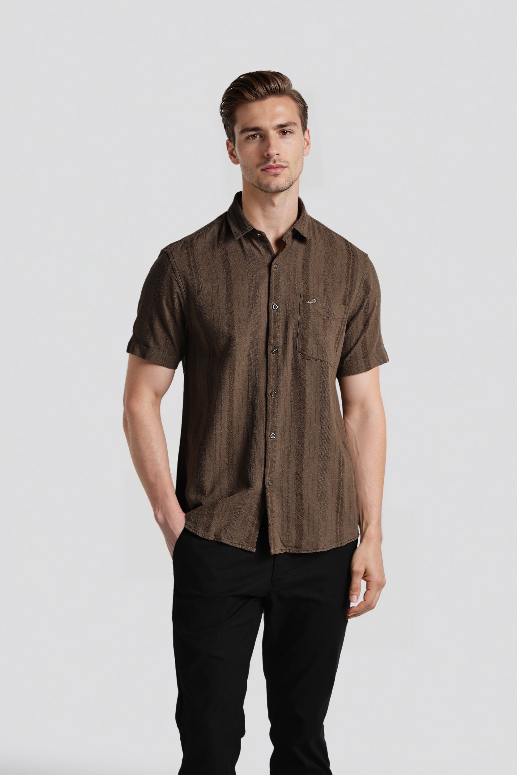 Man wearing a brown short-sleeve shirt against a white background