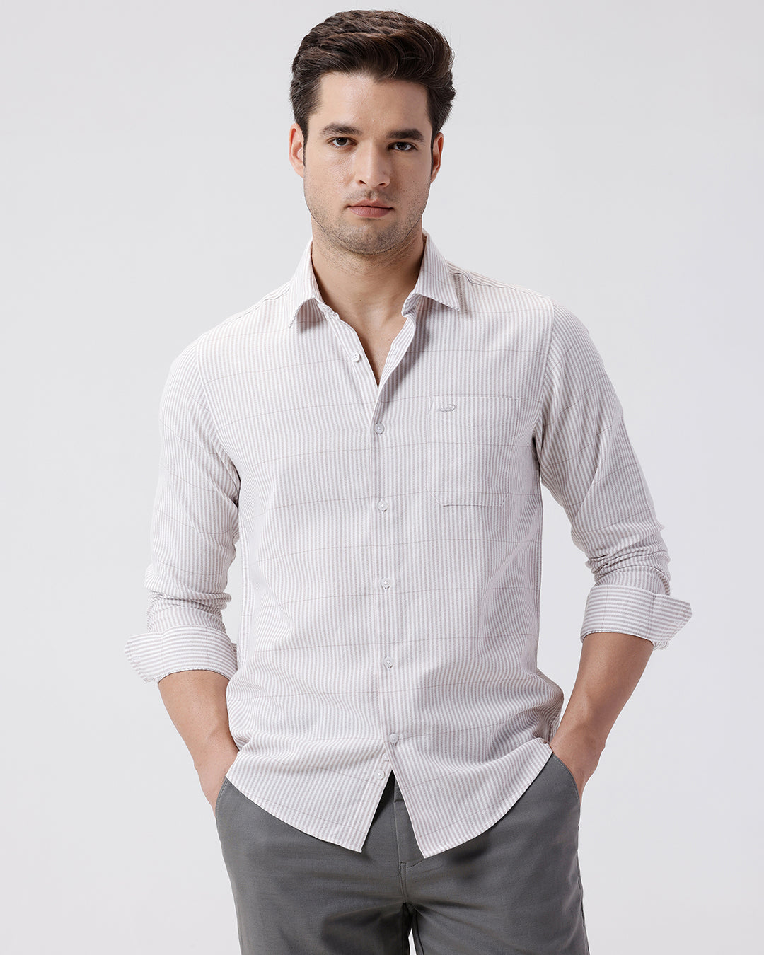 Man wearing a crepe texture stripe shirt light grape with casual styling on a gray background