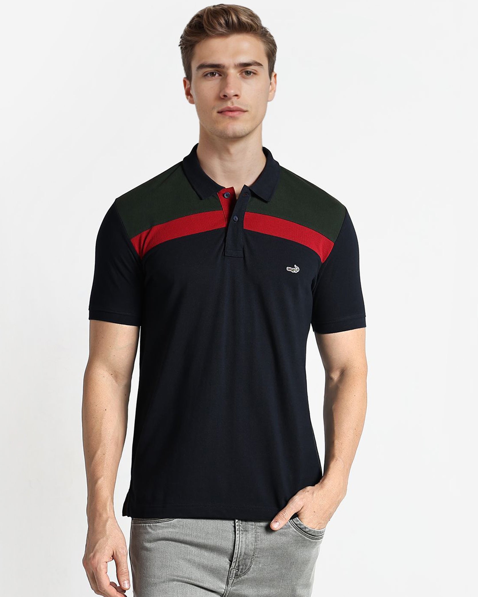 Man wearing a black polo shirt with red accents on a white background