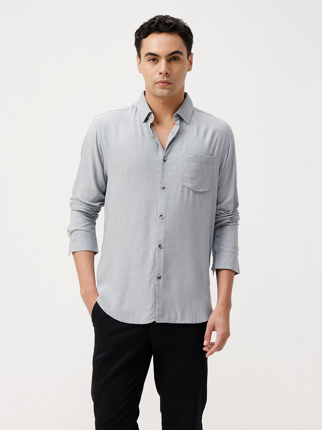 Man wearing a premium tensil linen shirt on a light gray background