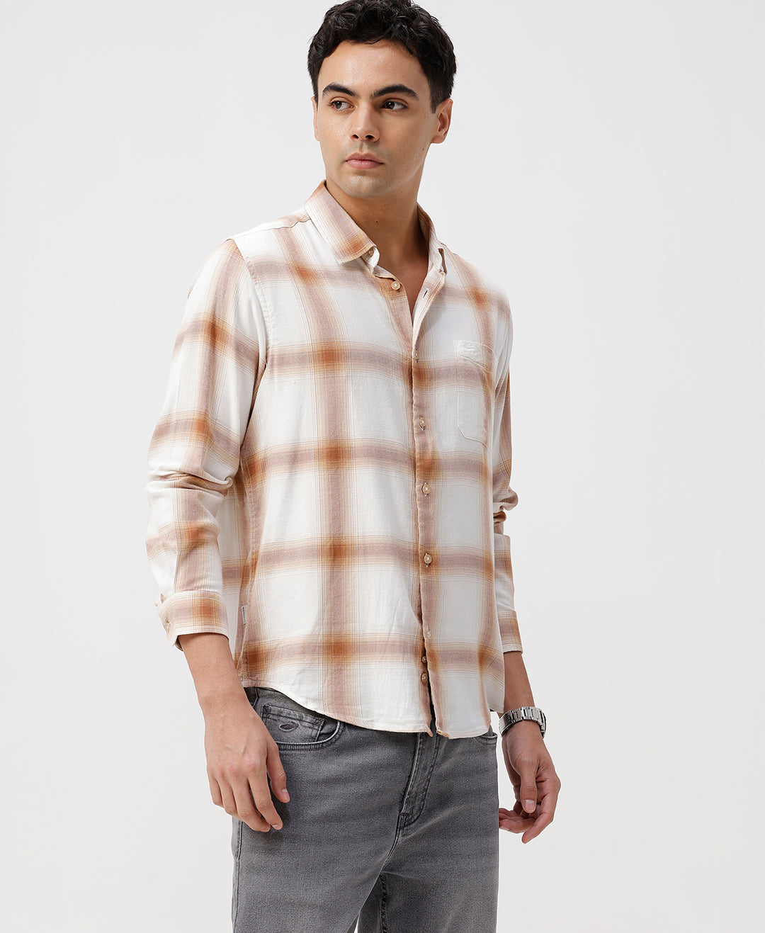Man wearing a red textured grunge print shirt with casual styling on a gray background