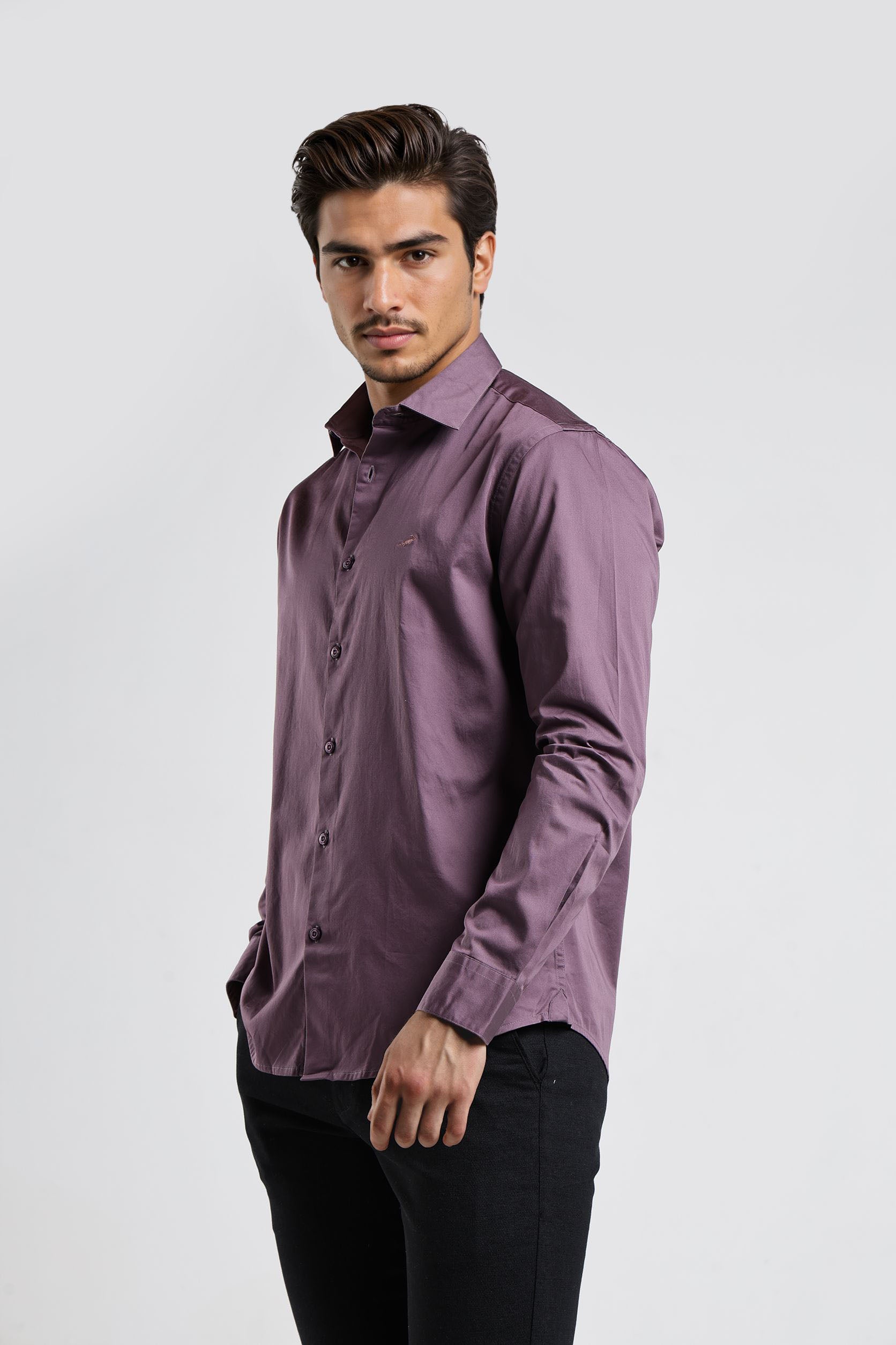 Man wearing a purple shirt against a white background