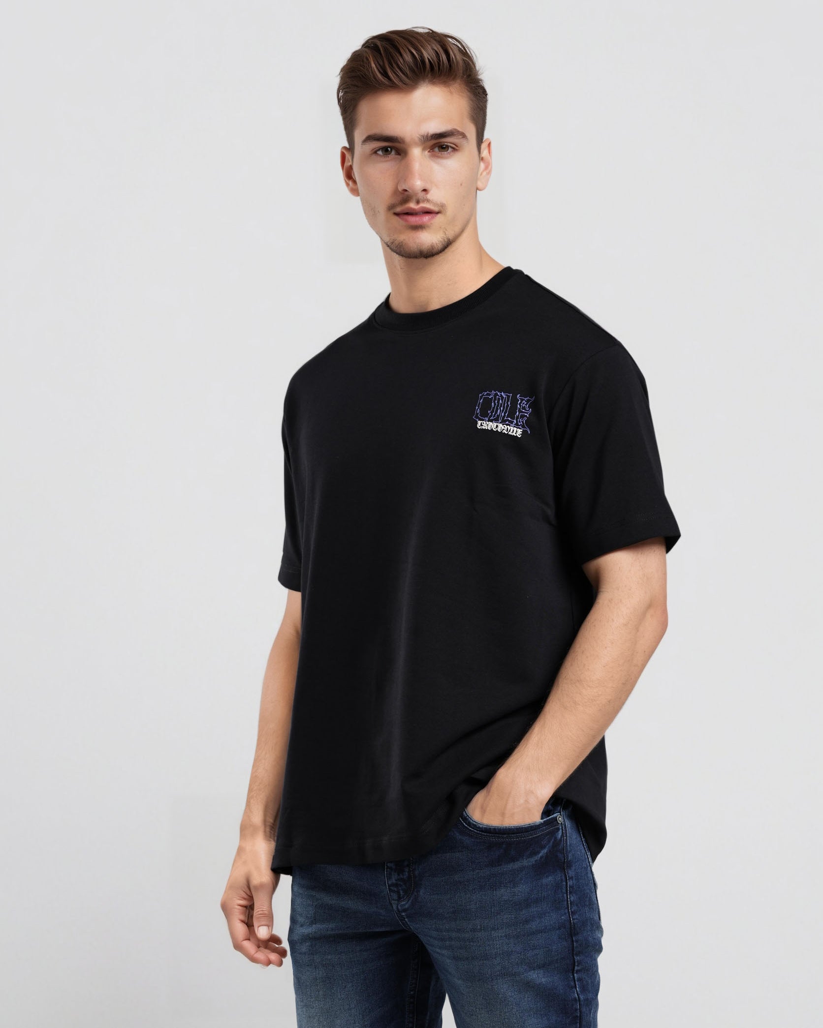 Man wearing a black t-shirt with a logo on a light gray background