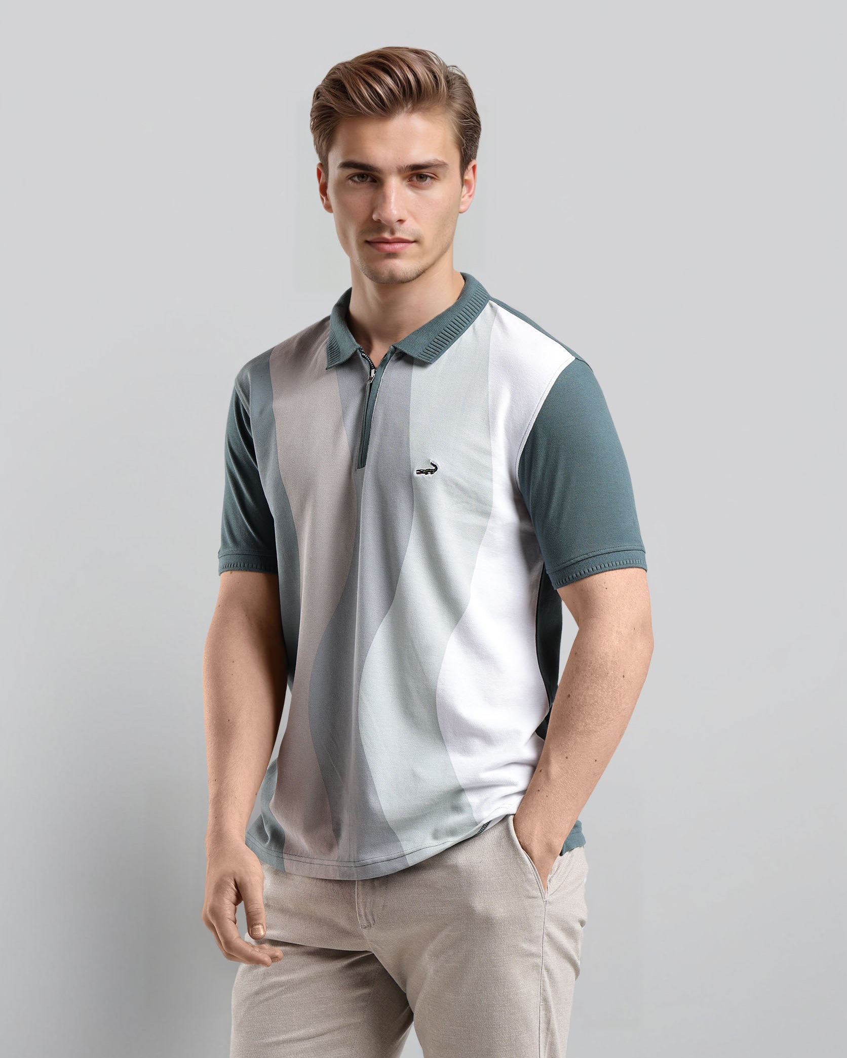 Man wearing a two-tone polo shirt with a plain background