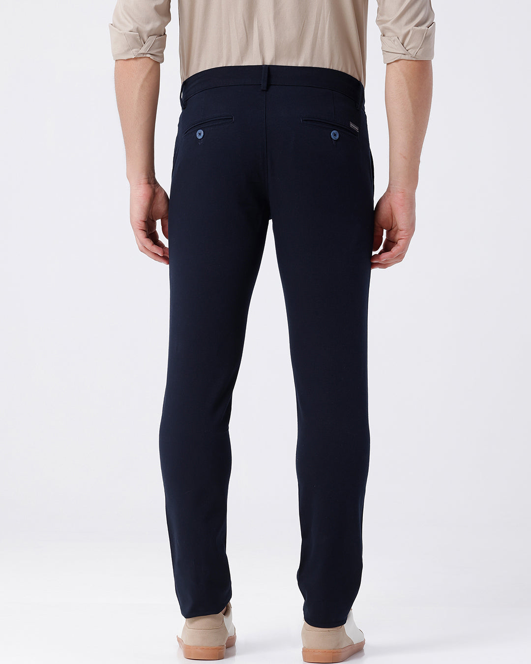 Man wearing a red textured essential chinos navy with casual styling on a gray background