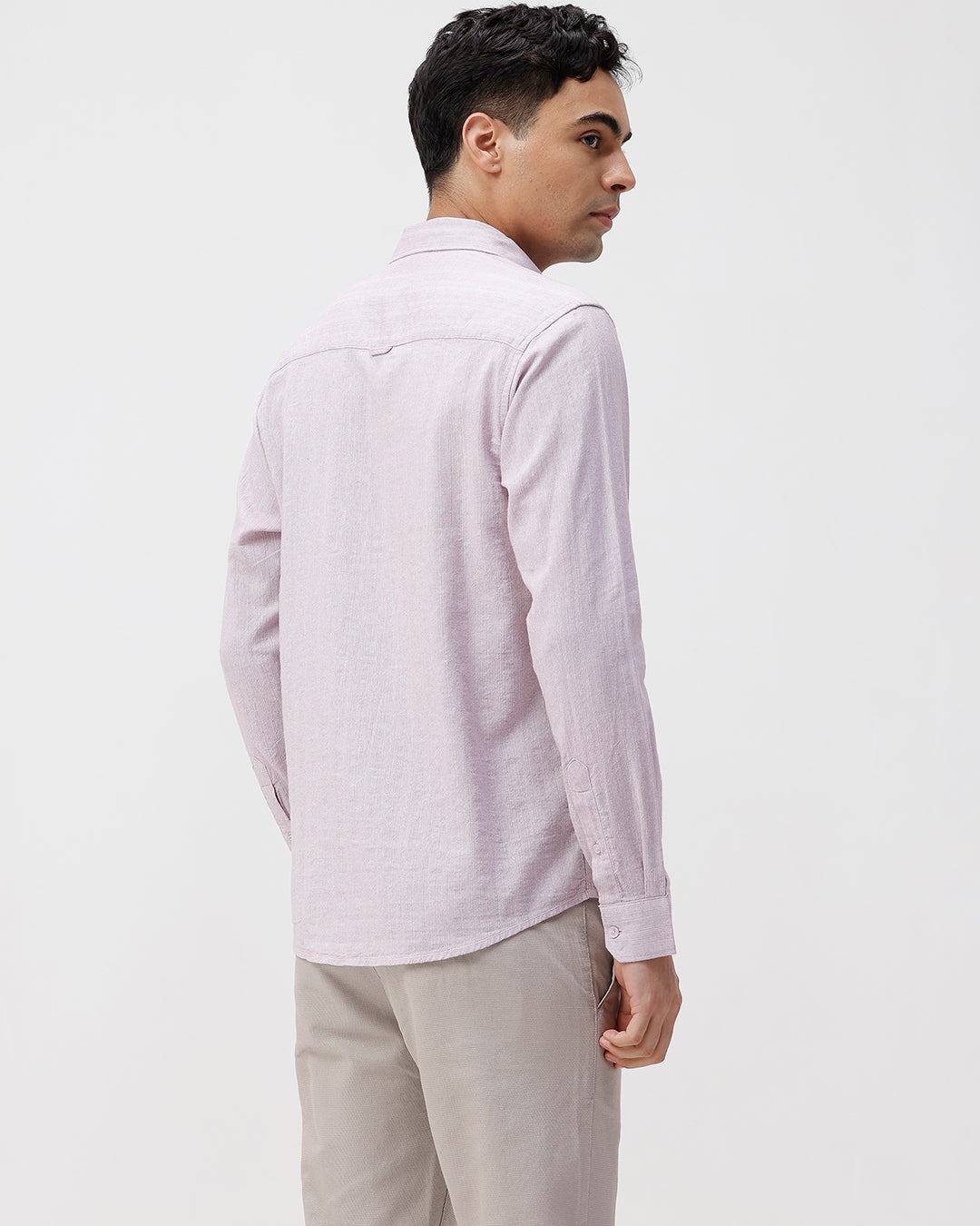 Man wearing a red rib textured cotton shirt light purple on a light gray background