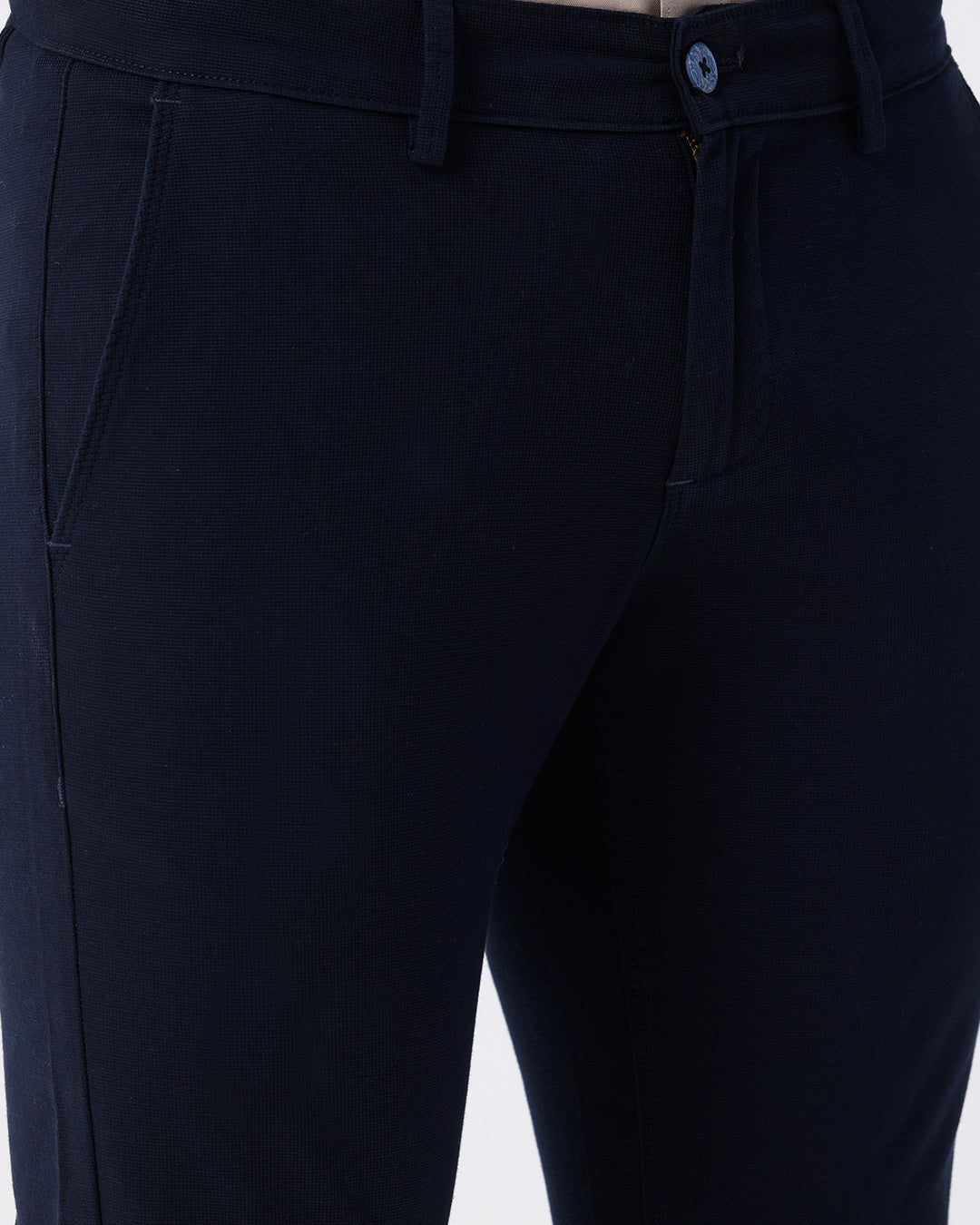 Man wearing a red textured essential chinos navy with casual styling on a gray background