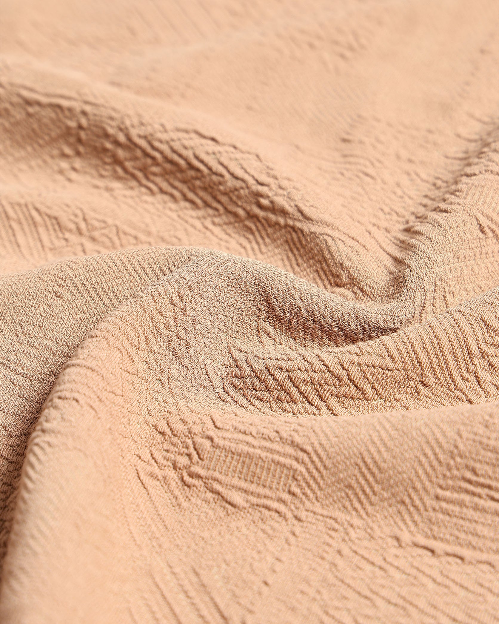 Close-up of textured beige fabric