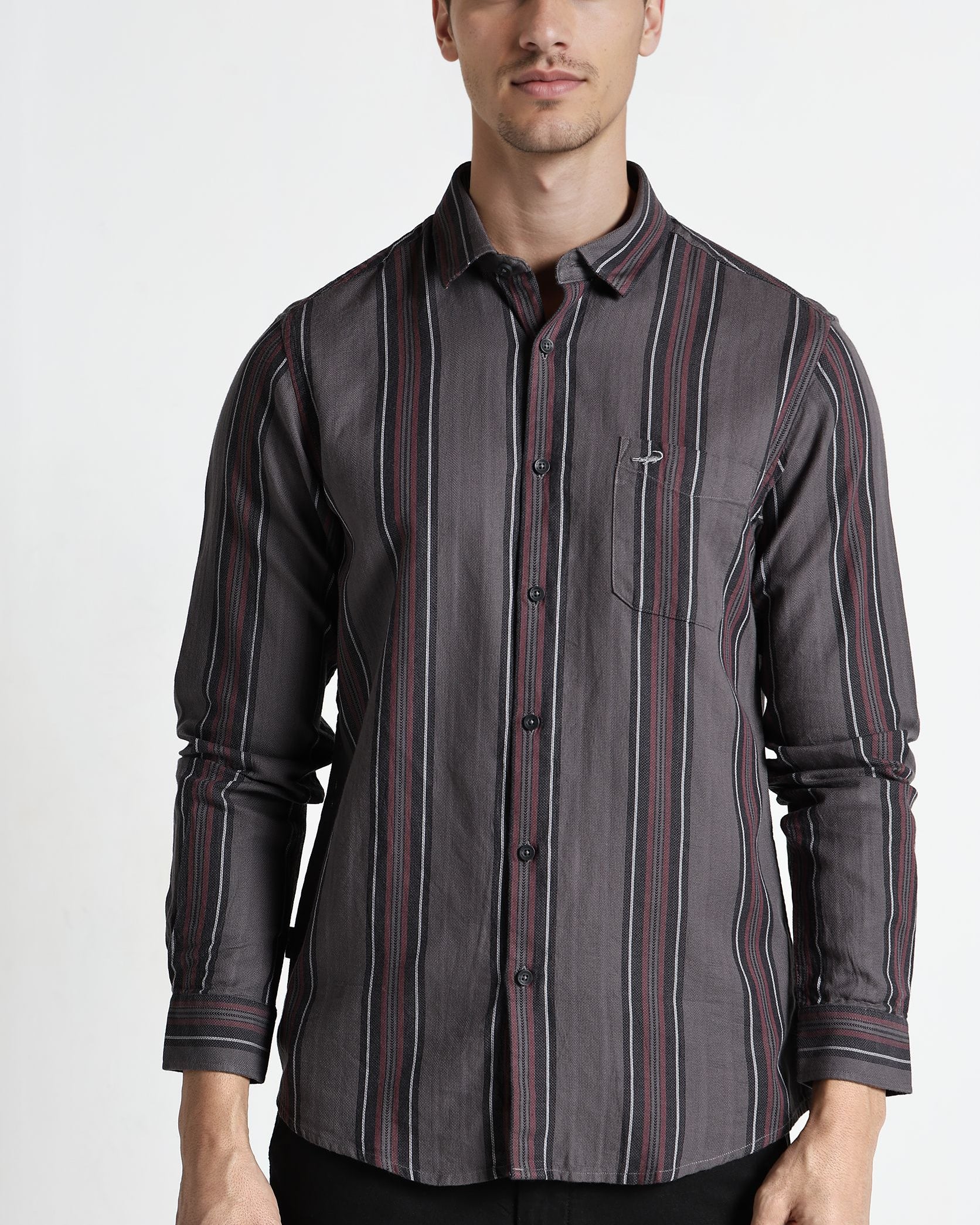 Man wearing a gray striped shirt on a white background