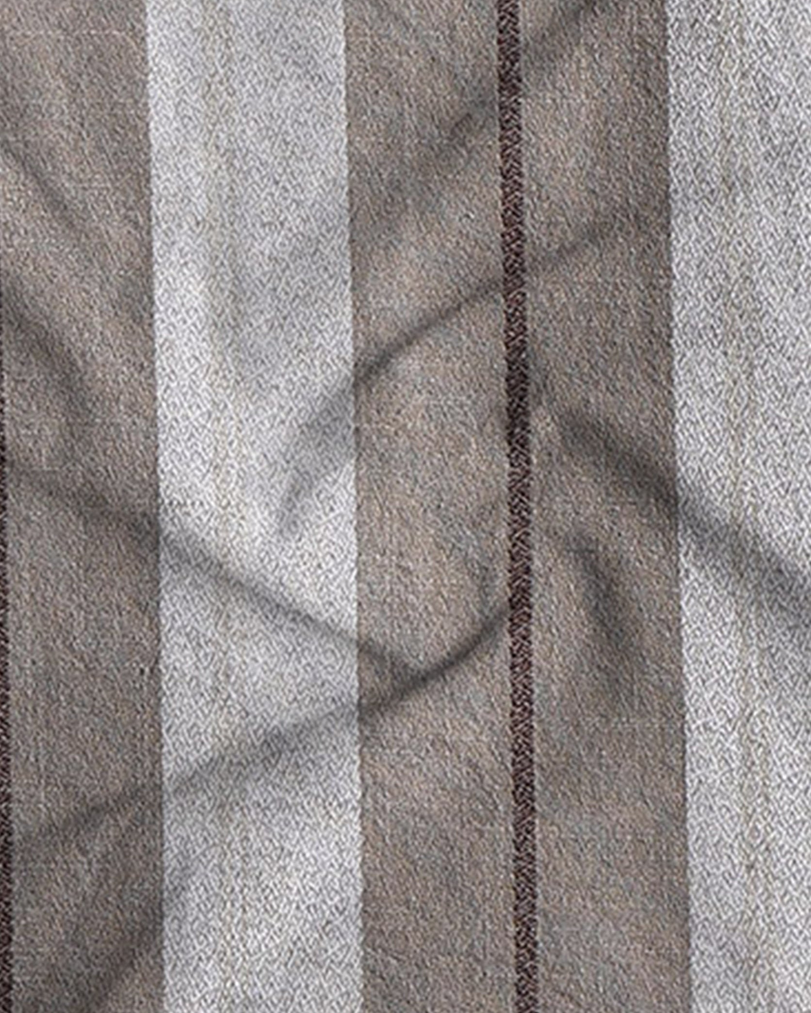Close-up of fabric with horizontal striped pattern in gray and brown tones.