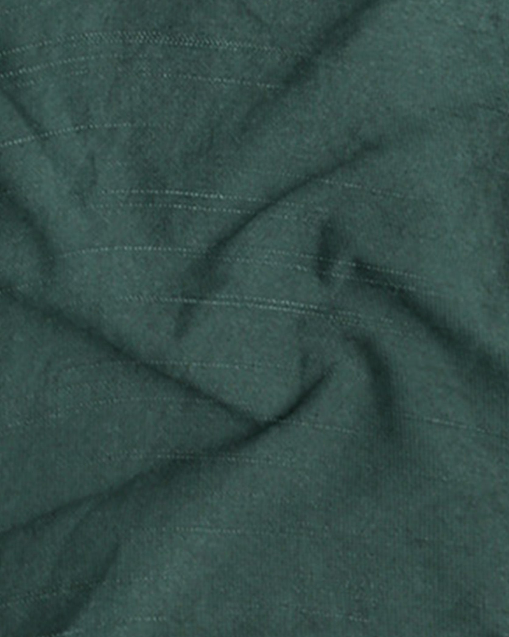Close-up of green fabric with subtle texture