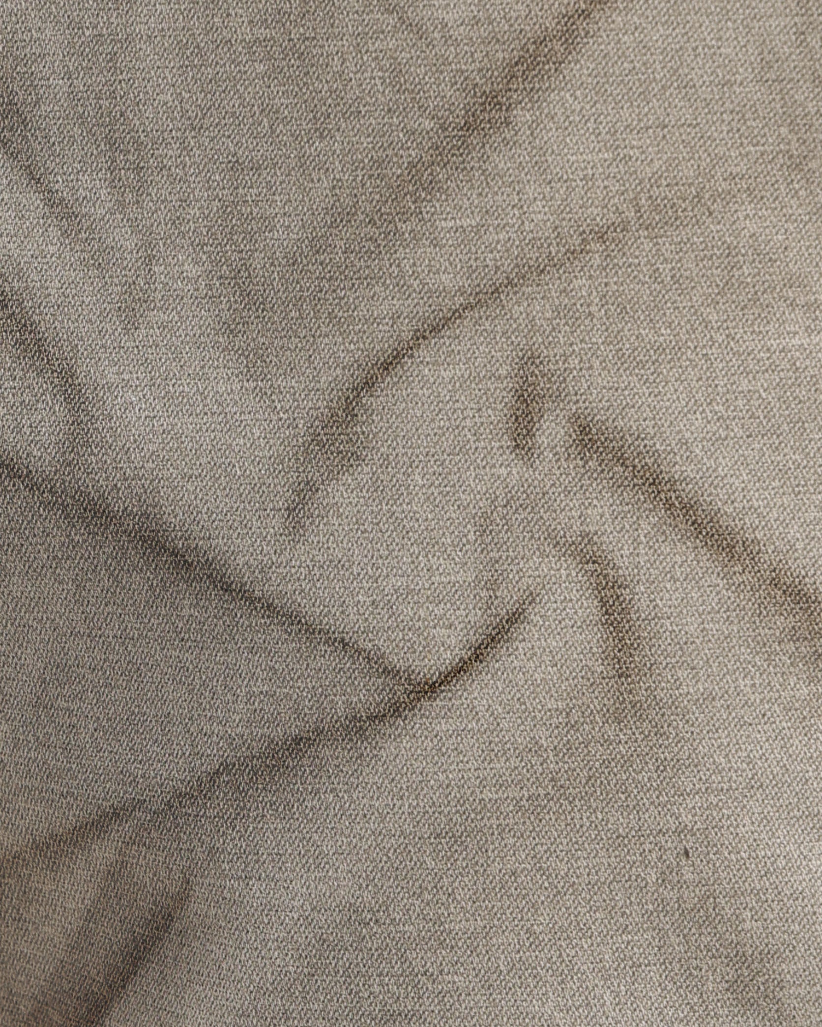 Close-up of beige fabric with visible texture