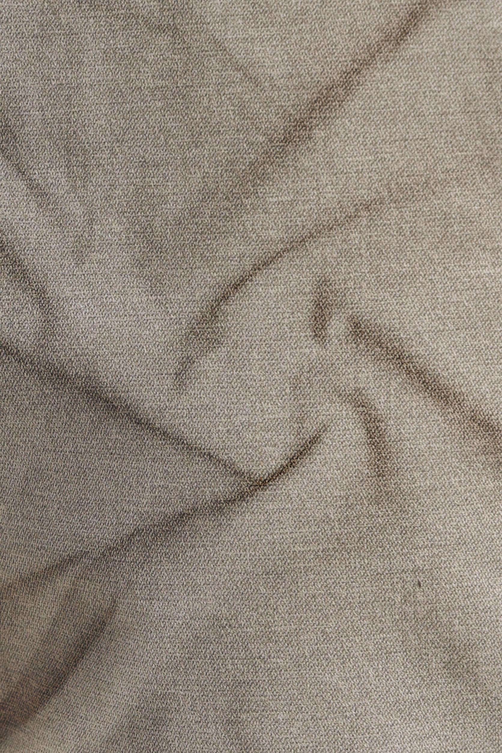 Close-up of beige fabric with visible texture