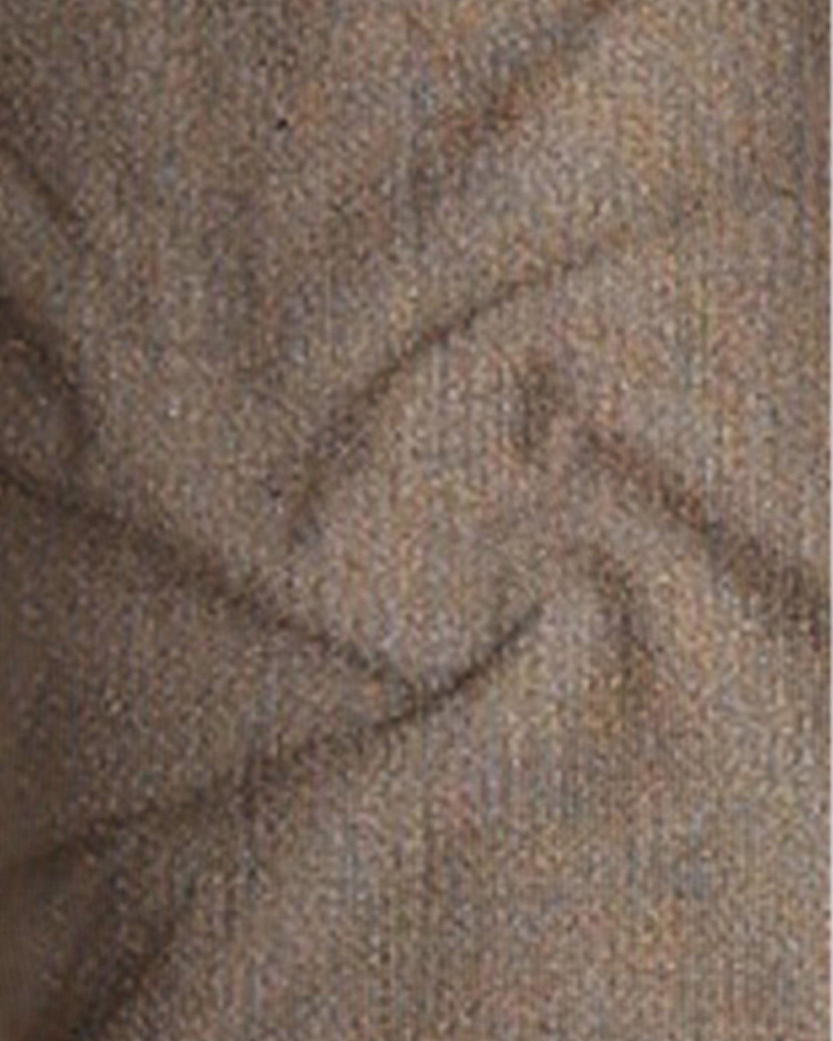 Close-up of textured brown fabric with a subtle pattern
