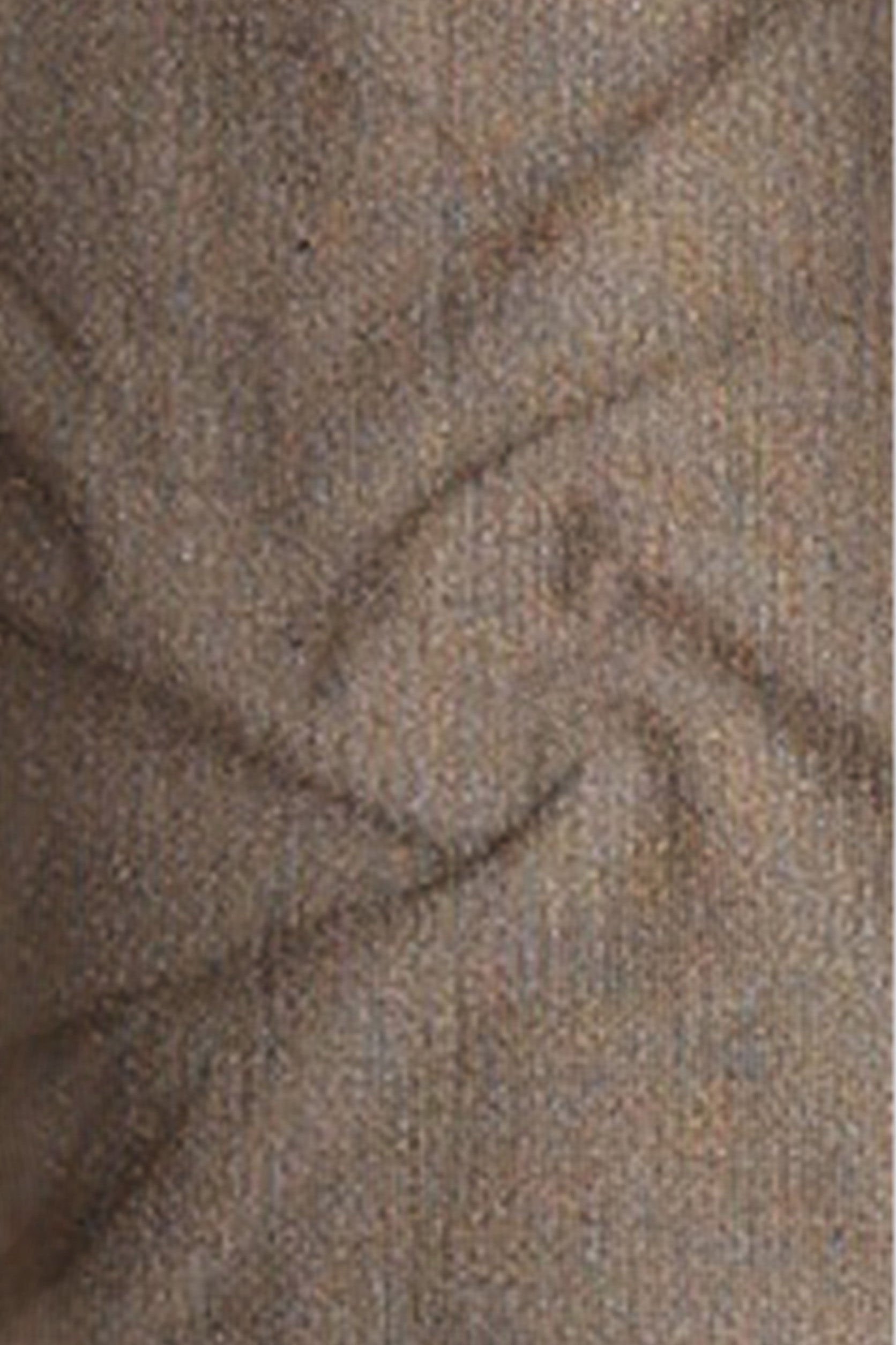 Close-up of textured brown fabric with a subtle pattern