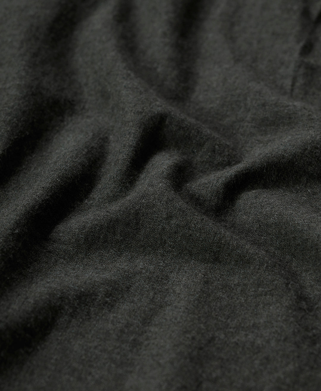 Close-up of olive fabric with texture detail