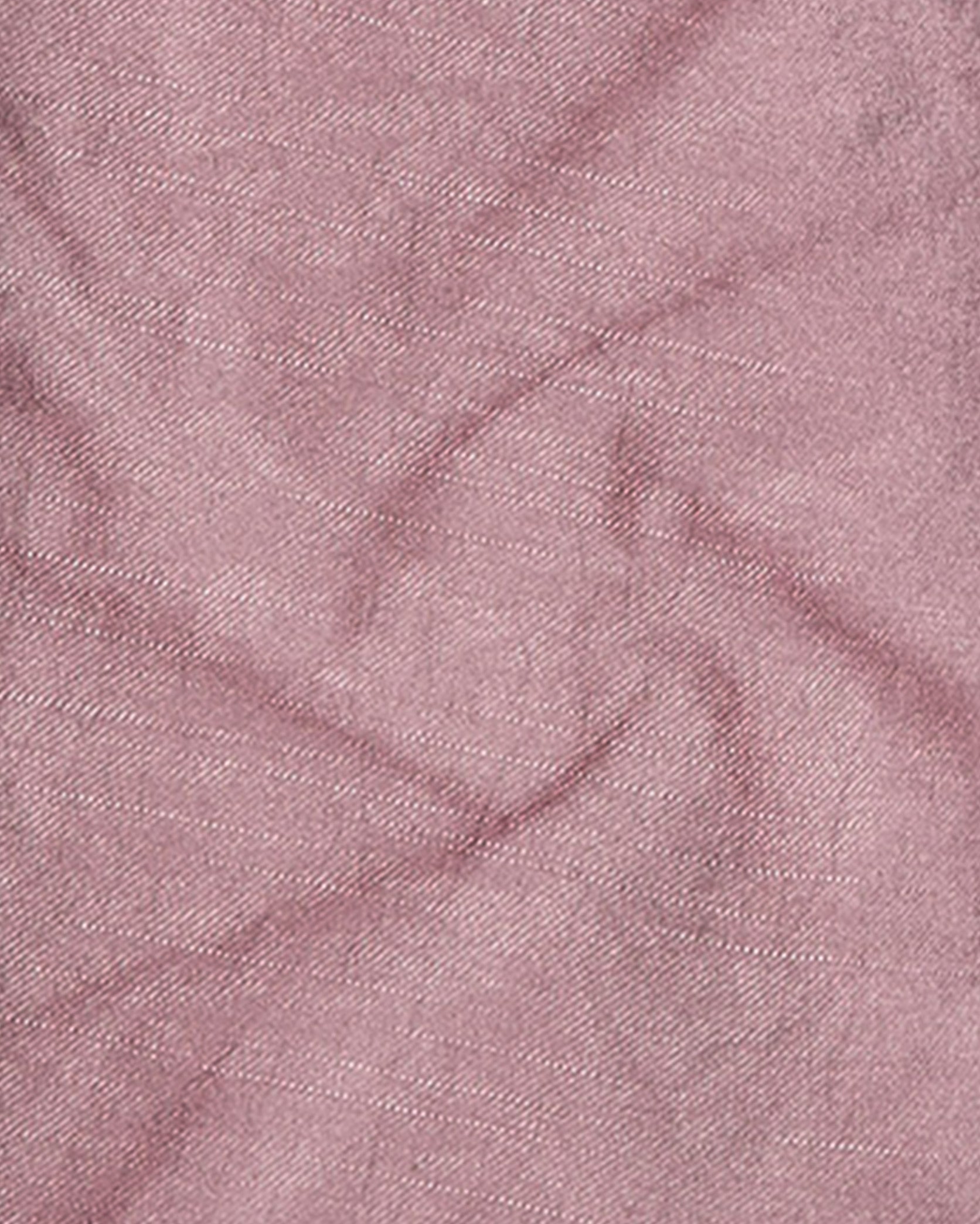 Close-up of pink fabric with a textured pattern