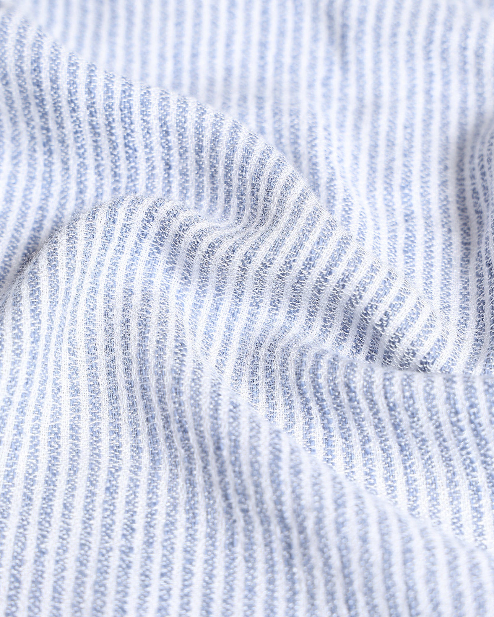 Close-up of blue and white striped fabric texture
