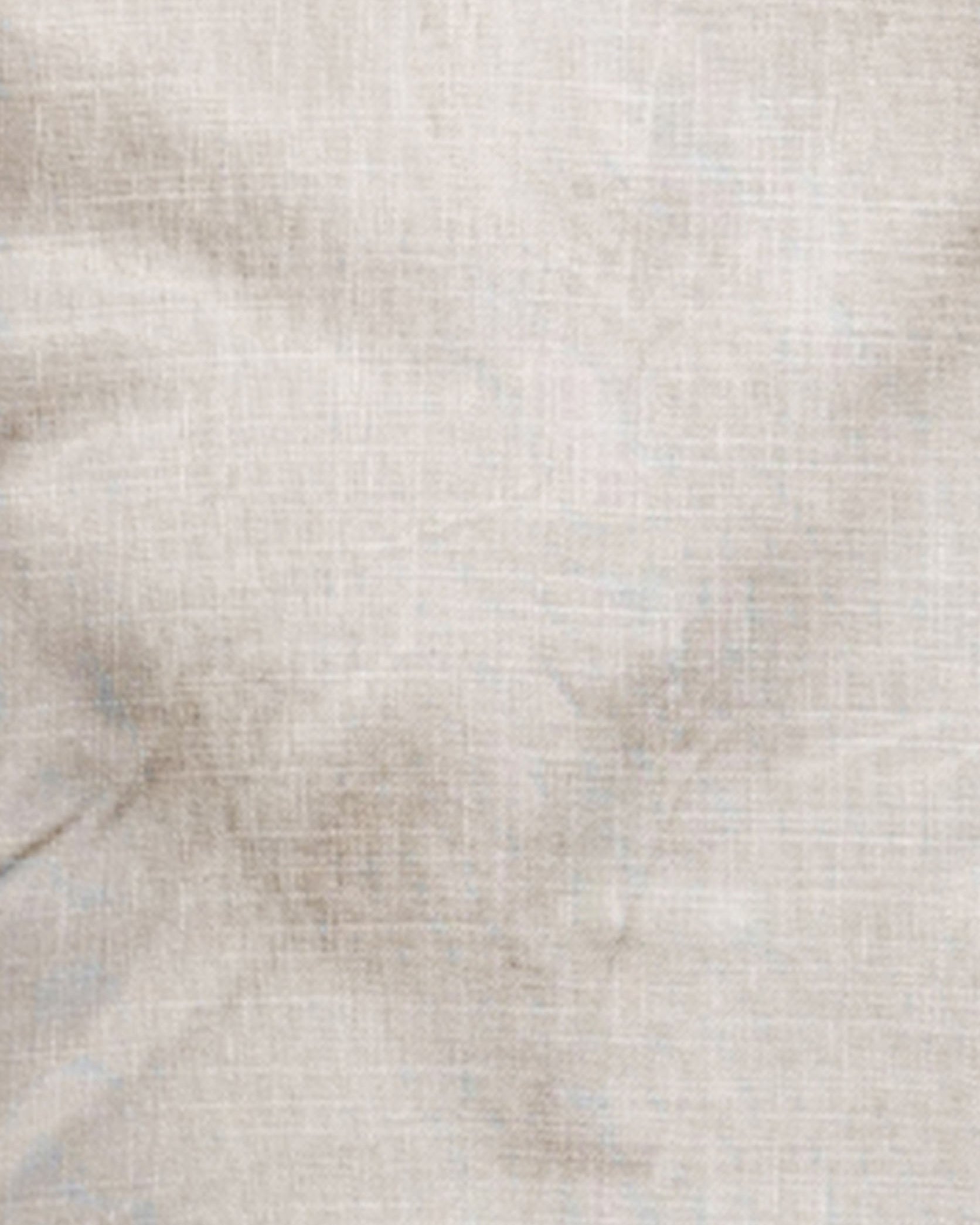 Close-up of a textured beige fabric surface