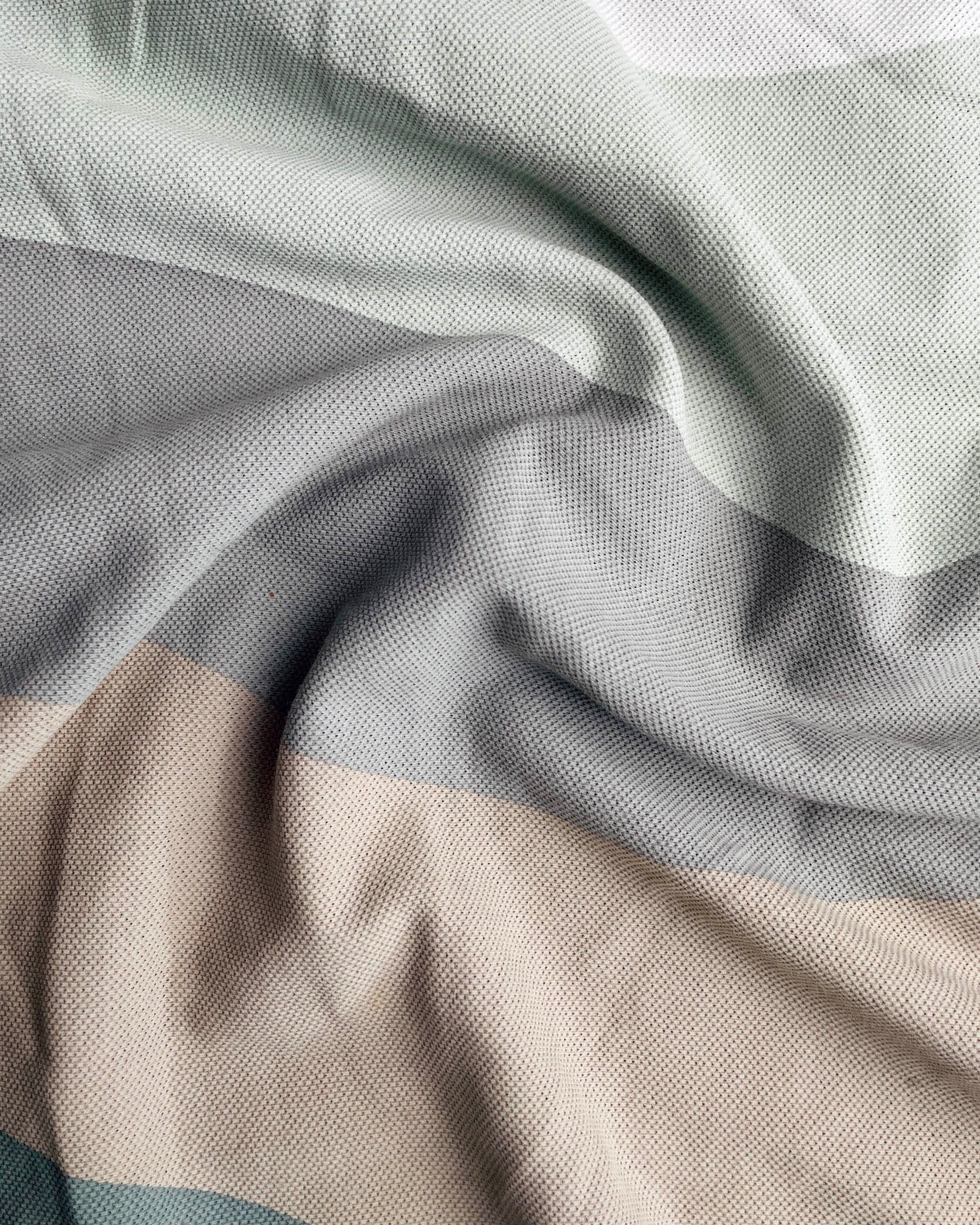 Close-up of fabric with gray and beige stripes