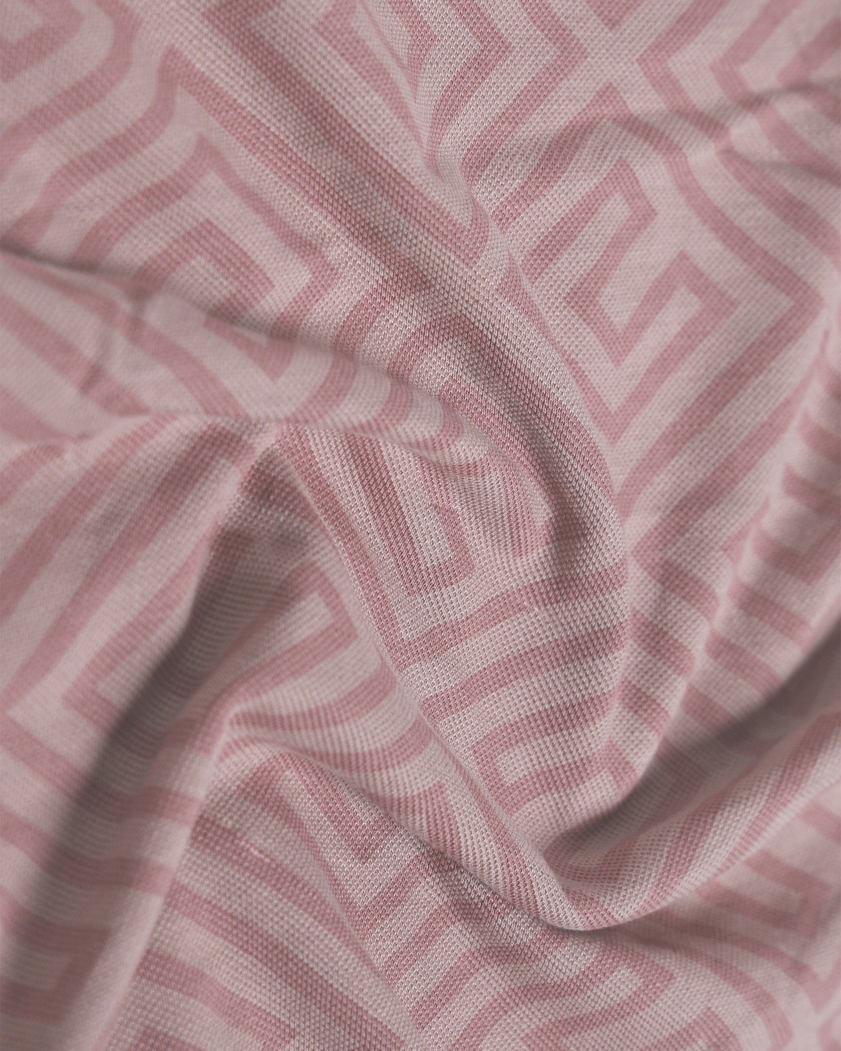 Close-up of pink fabric with geometric pattern