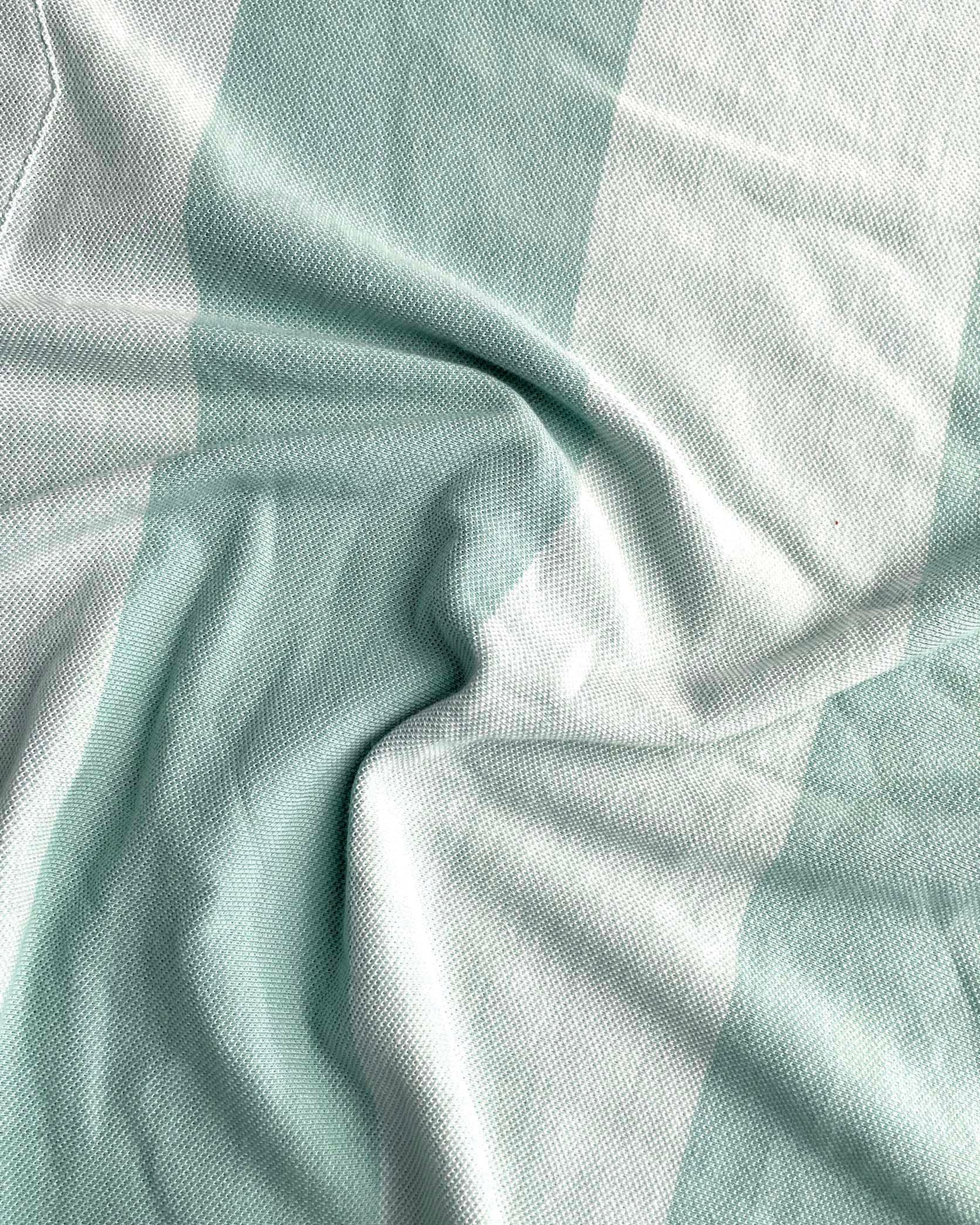 Close-up of light blue fabric with a checkered pattern