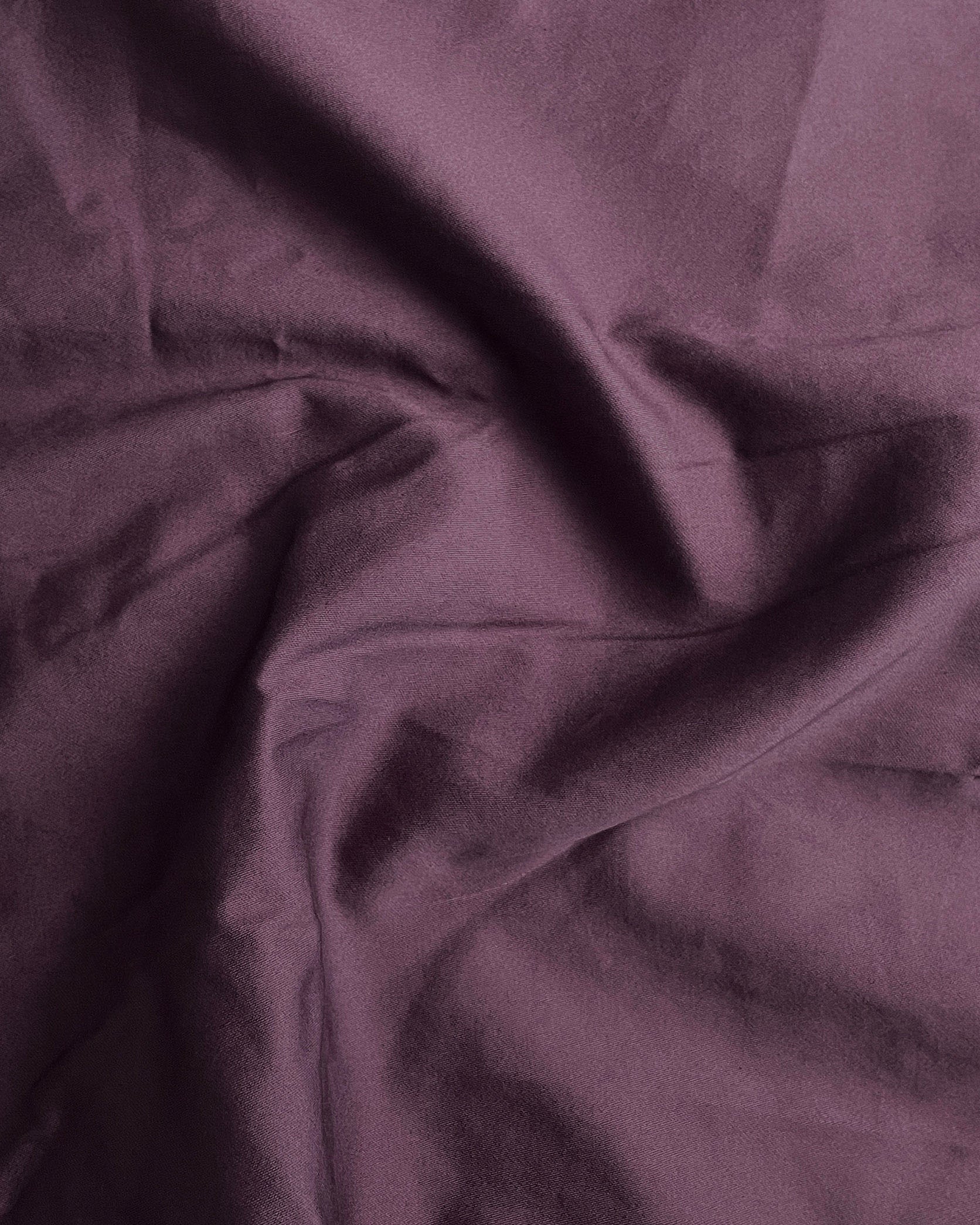 Close-up of purple fabric with folds