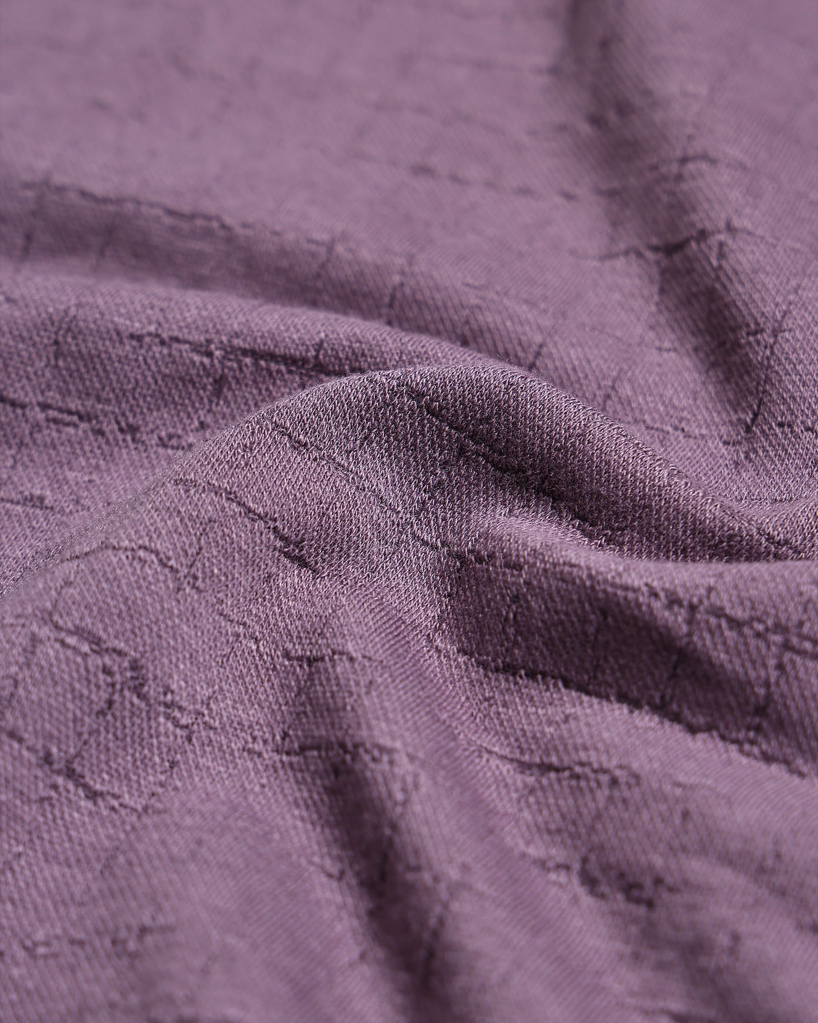 Close-up of textured purple fabric