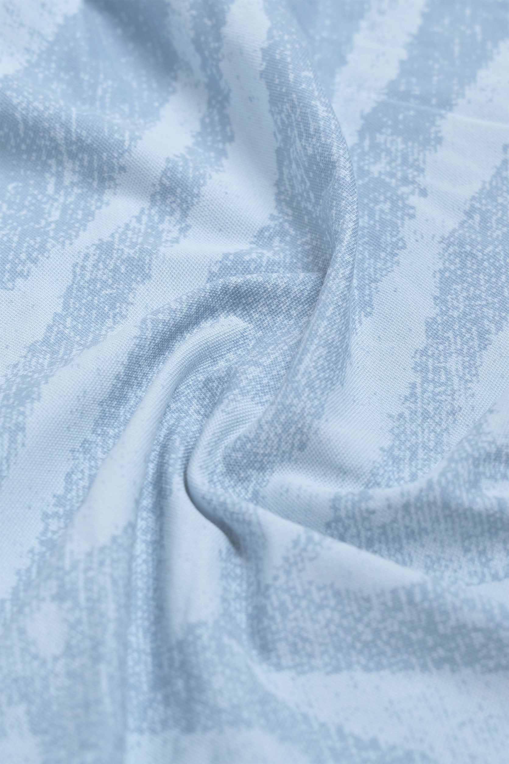 Close-up of light blue fabric with a subtle pattern