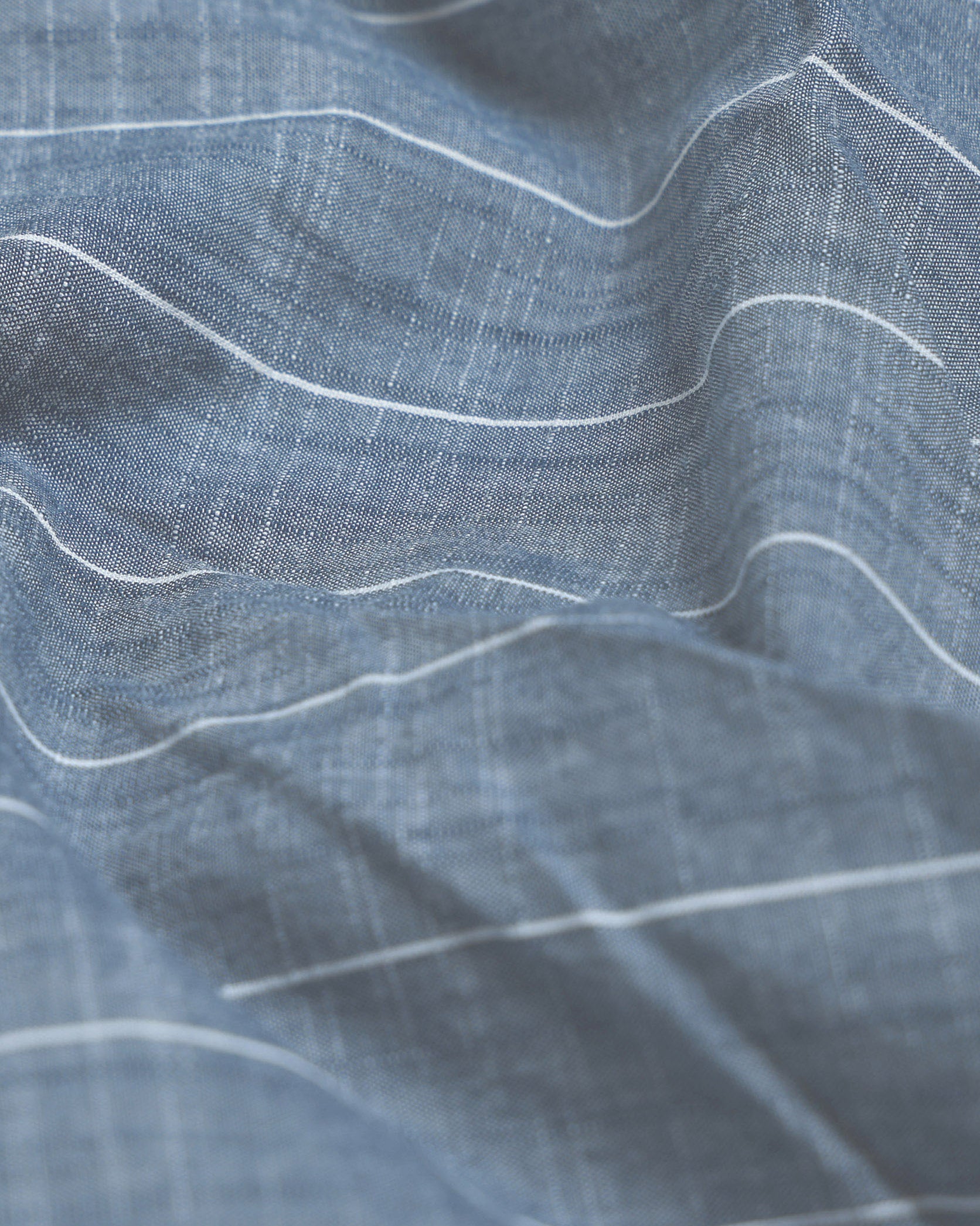 Close-up of blue fabric with white lines