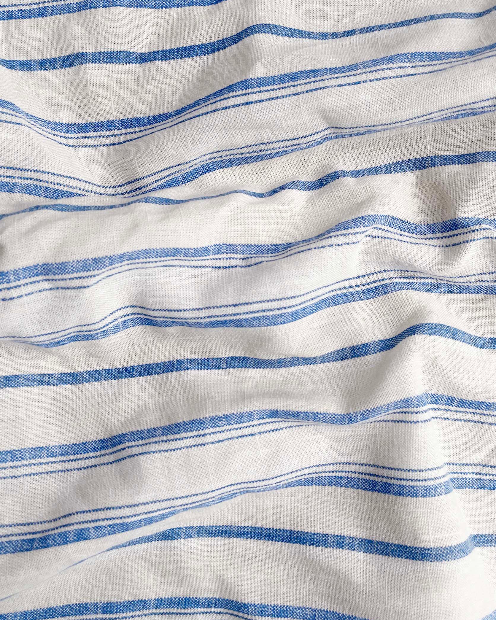 Close-up of fabric with blue and white horizontal stripes