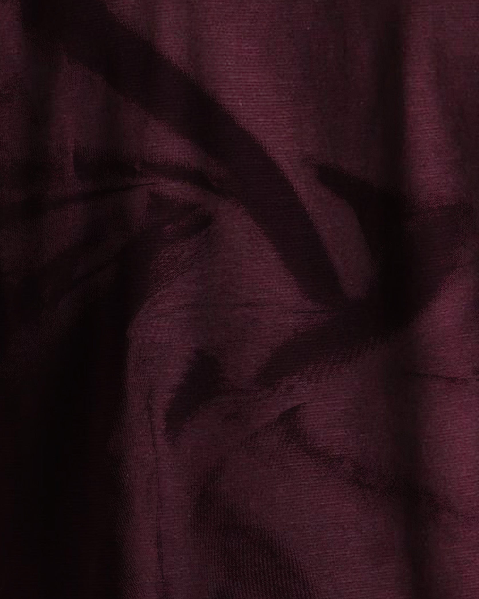 Close-up of dark purple fabric with visible texture
