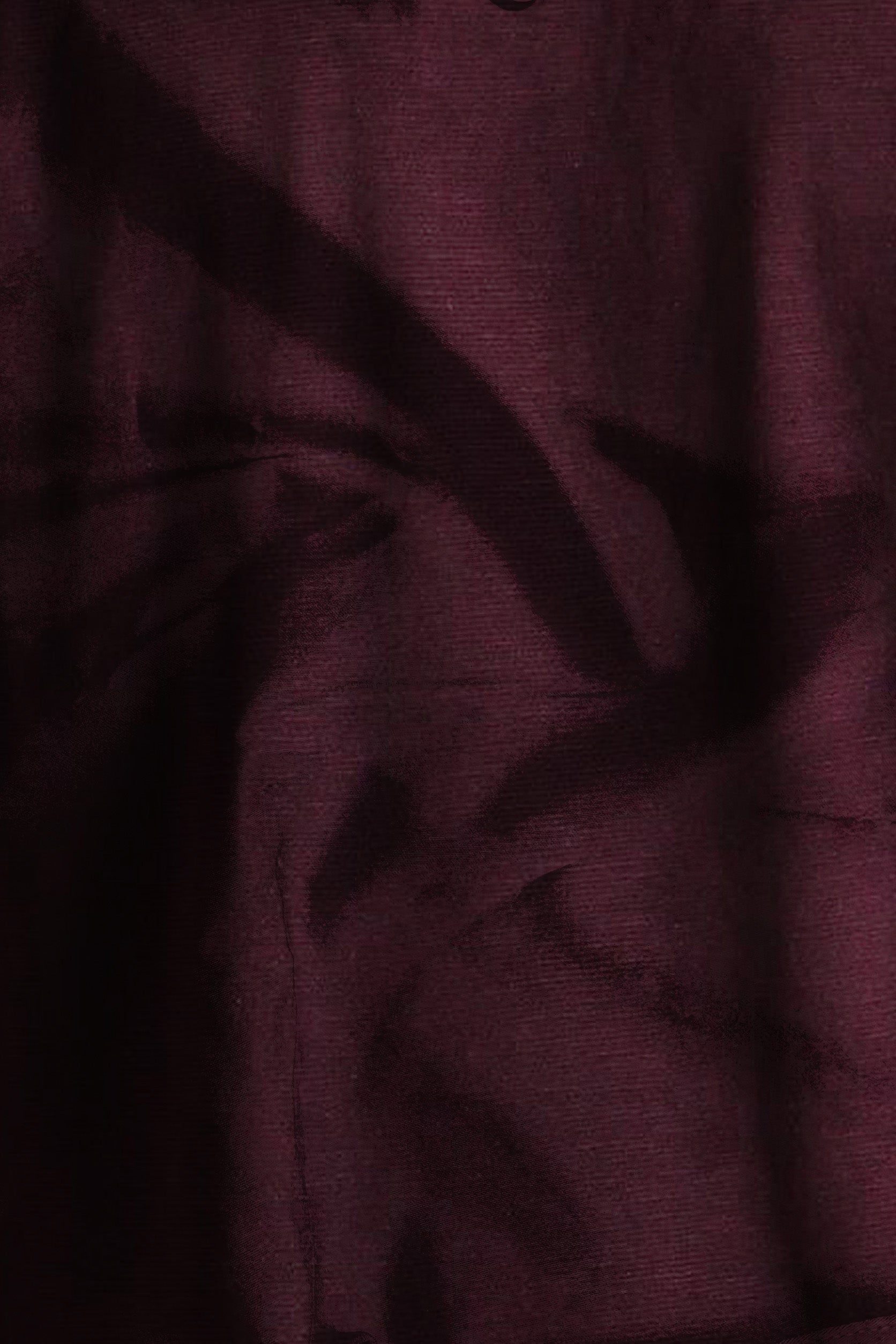 Close-up of dark purple fabric with visible texture