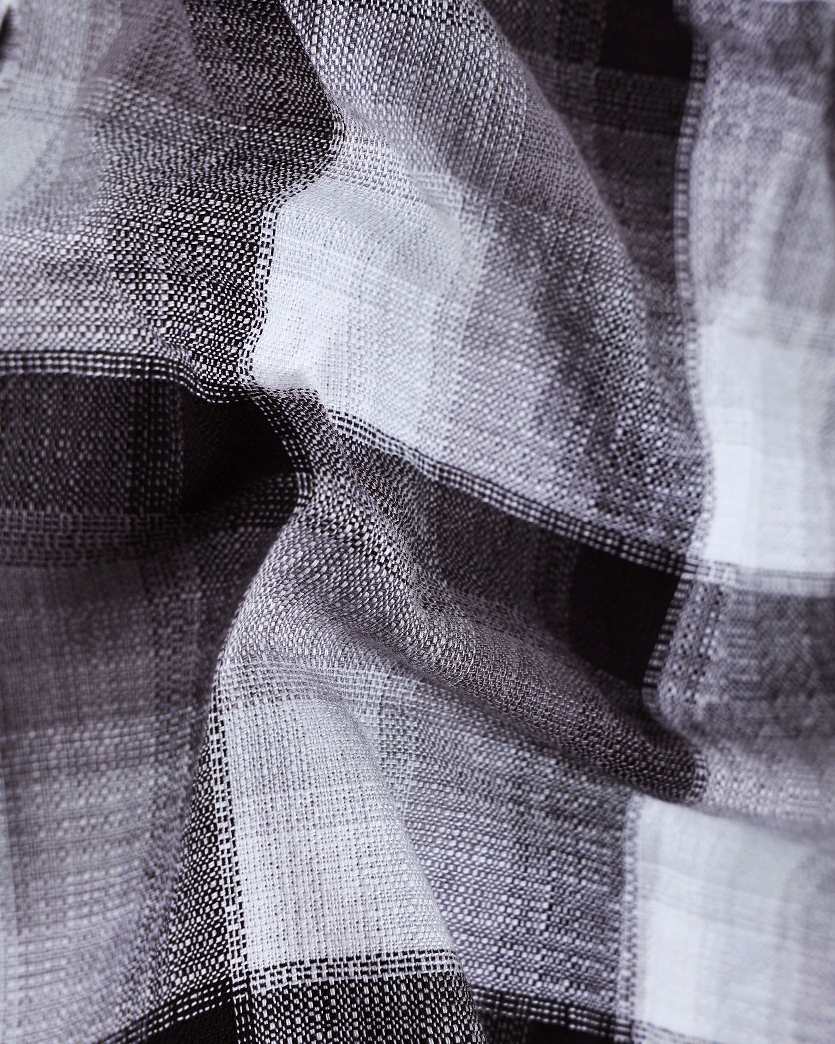 Close-up of a textured fabric with black and white patterns