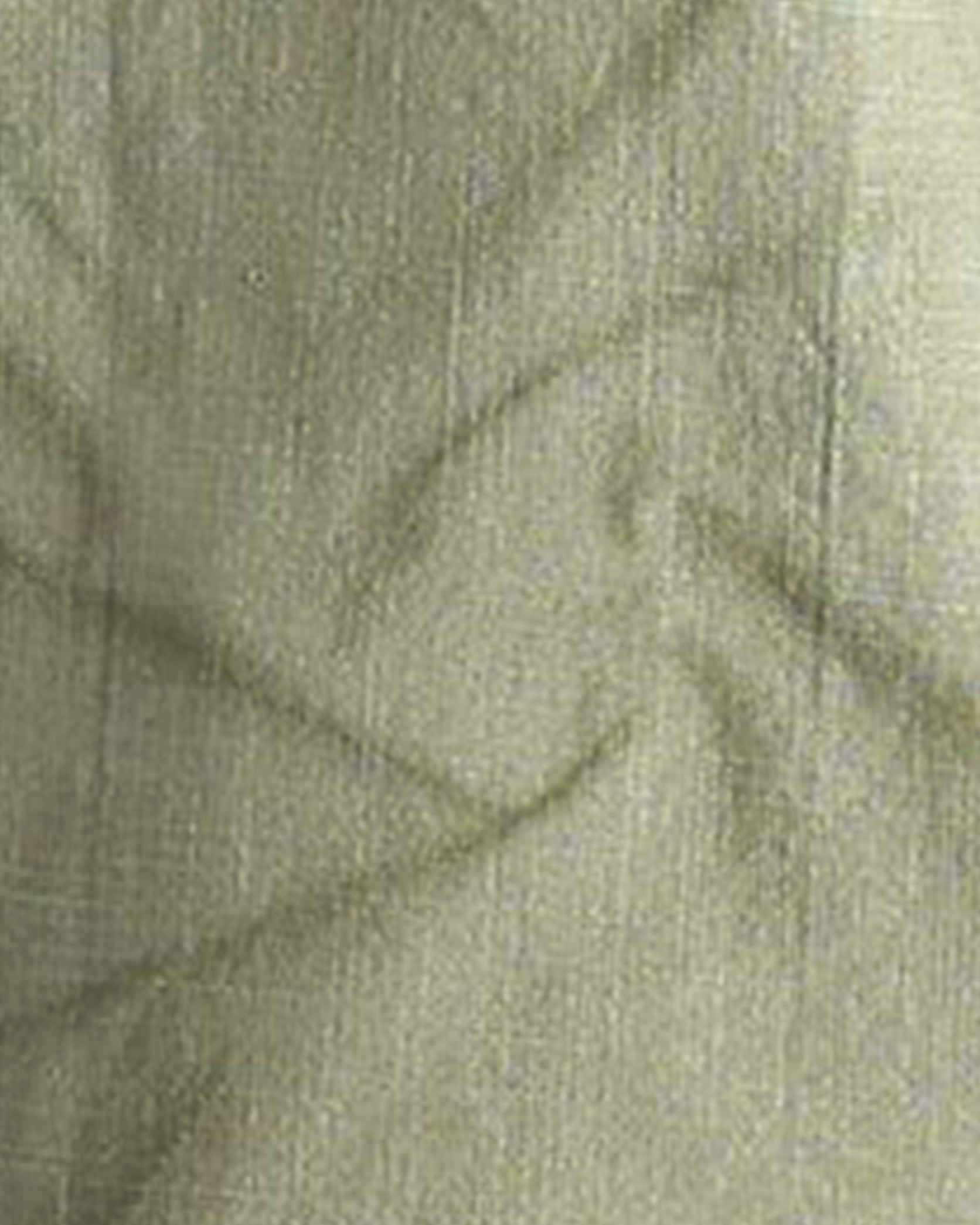 Close-up of green fabric with a textured pattern