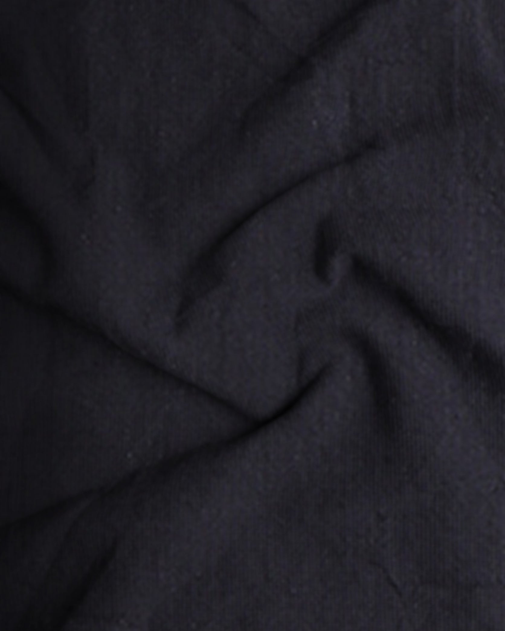 Close-up of dark gray fabric with visible texture