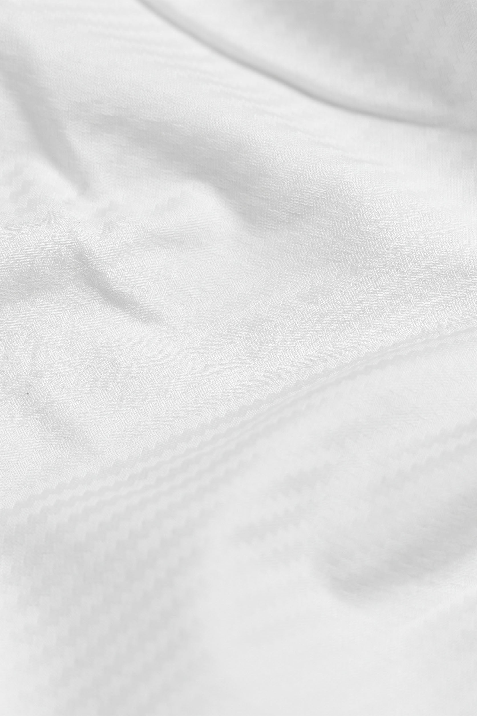 Close-up of white fabric with subtle texture
