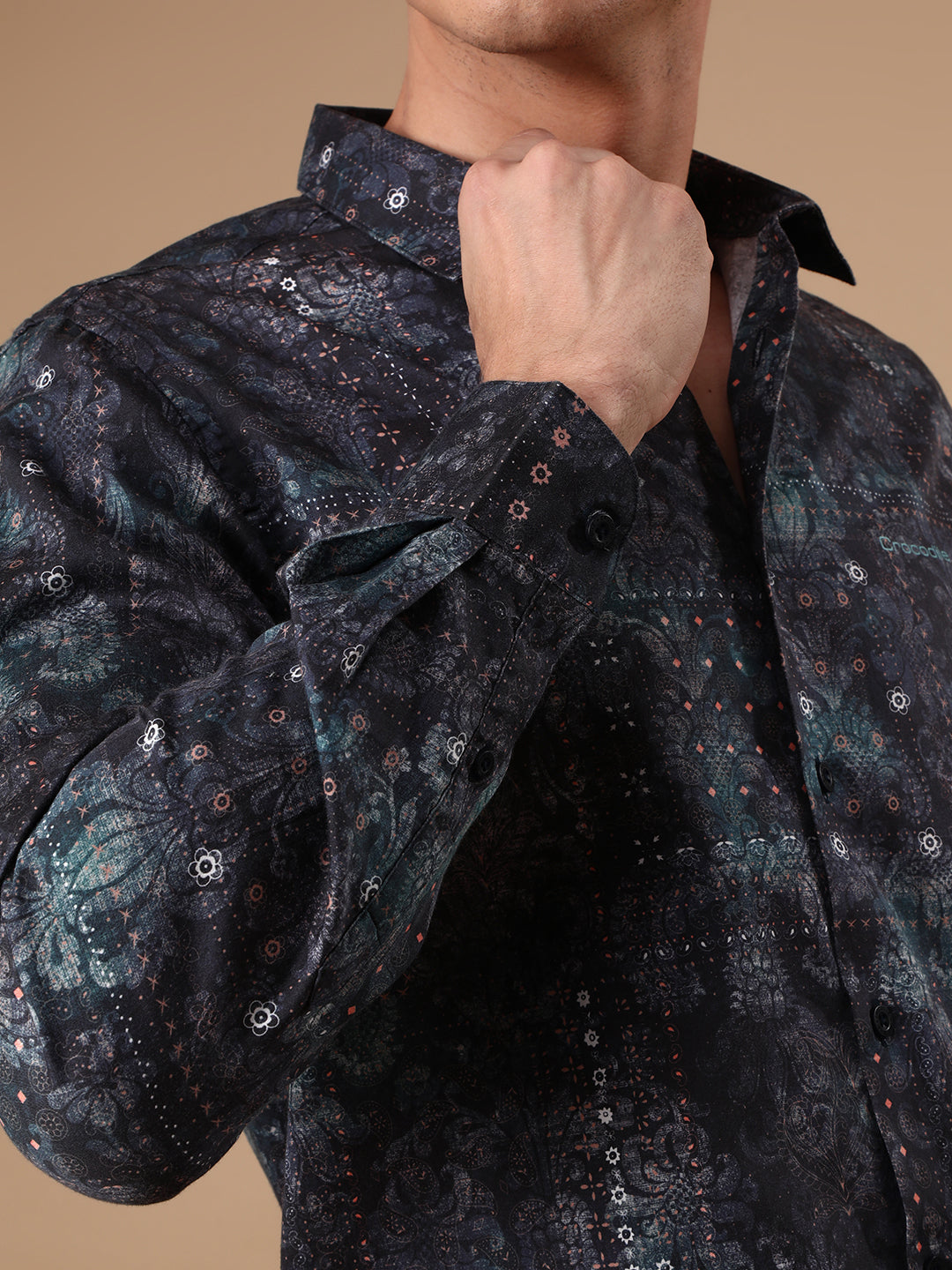 Man wearing a navy printed full sleeve 100% cotton navy casual shirt on a light gray background