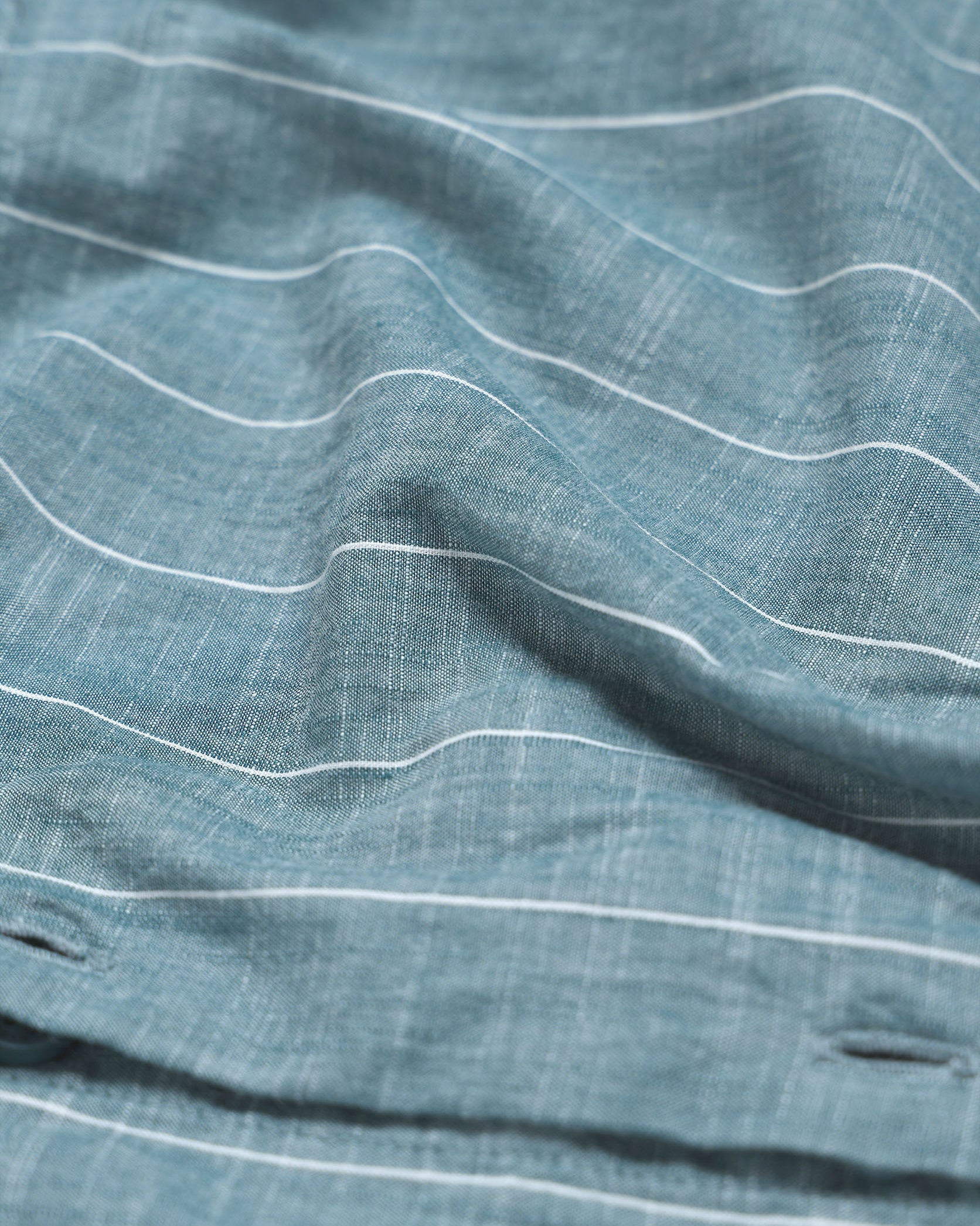 Close-up of blue fabric with white lines