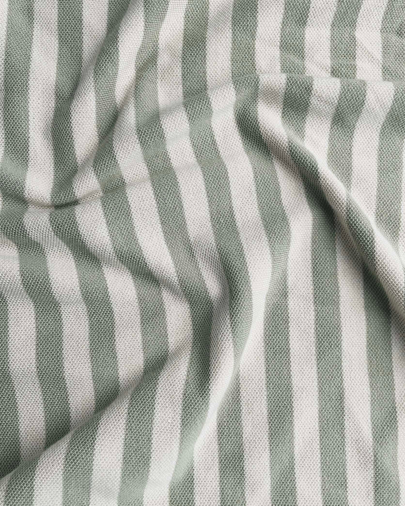 Close-up of striped fabric with alternating light and dark gray stripes.