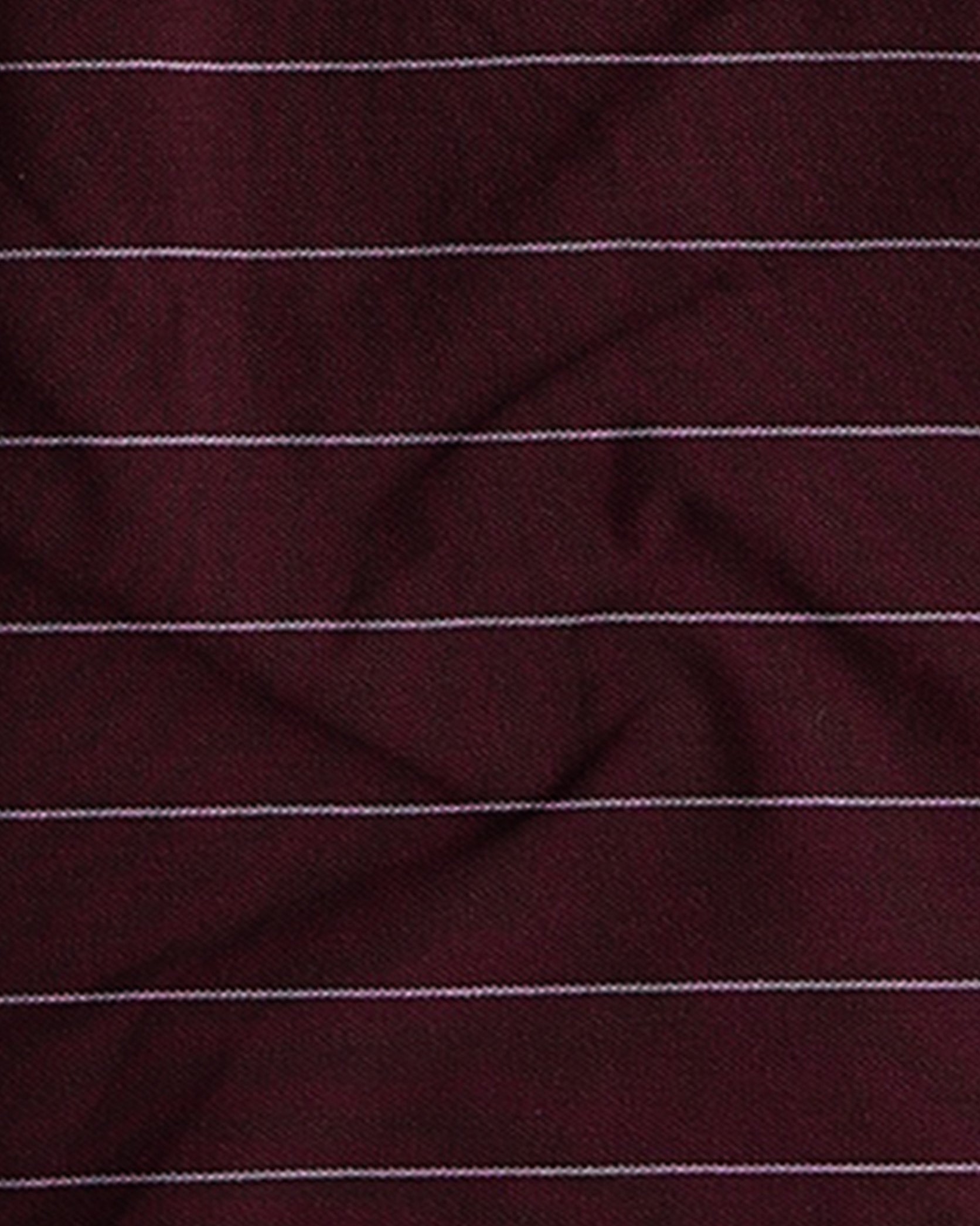 Close-up of maroon fabric with thin white stripes