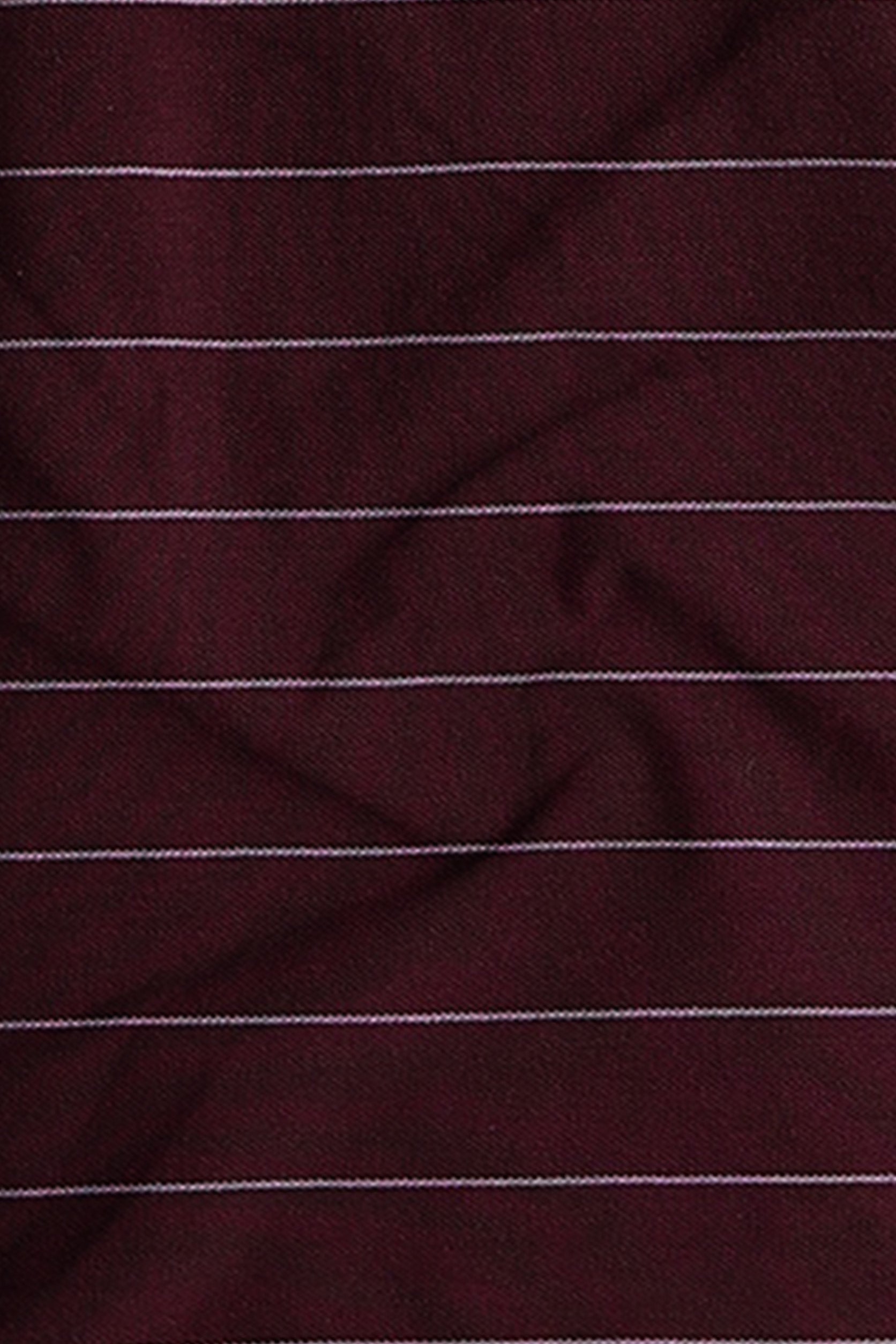 Close-up of maroon fabric with thin white stripes
